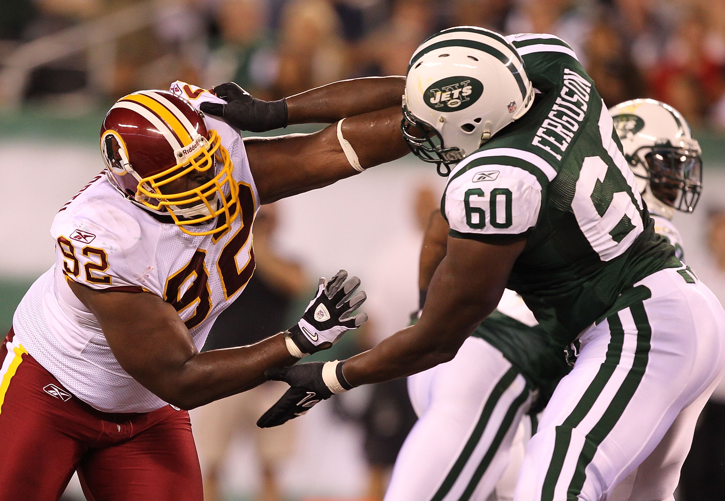 EAST RUTHERFORD, NJ - AUGUST 27:  Albert Haynesworth #92 of the Washington Redskins battles D'Brickashaw Ferguson #60 of the New York Jets during their preseason game on August 27, 2010 at the New Meadowlands Stadium  in East Rutherford, New Jersey.  (Pho