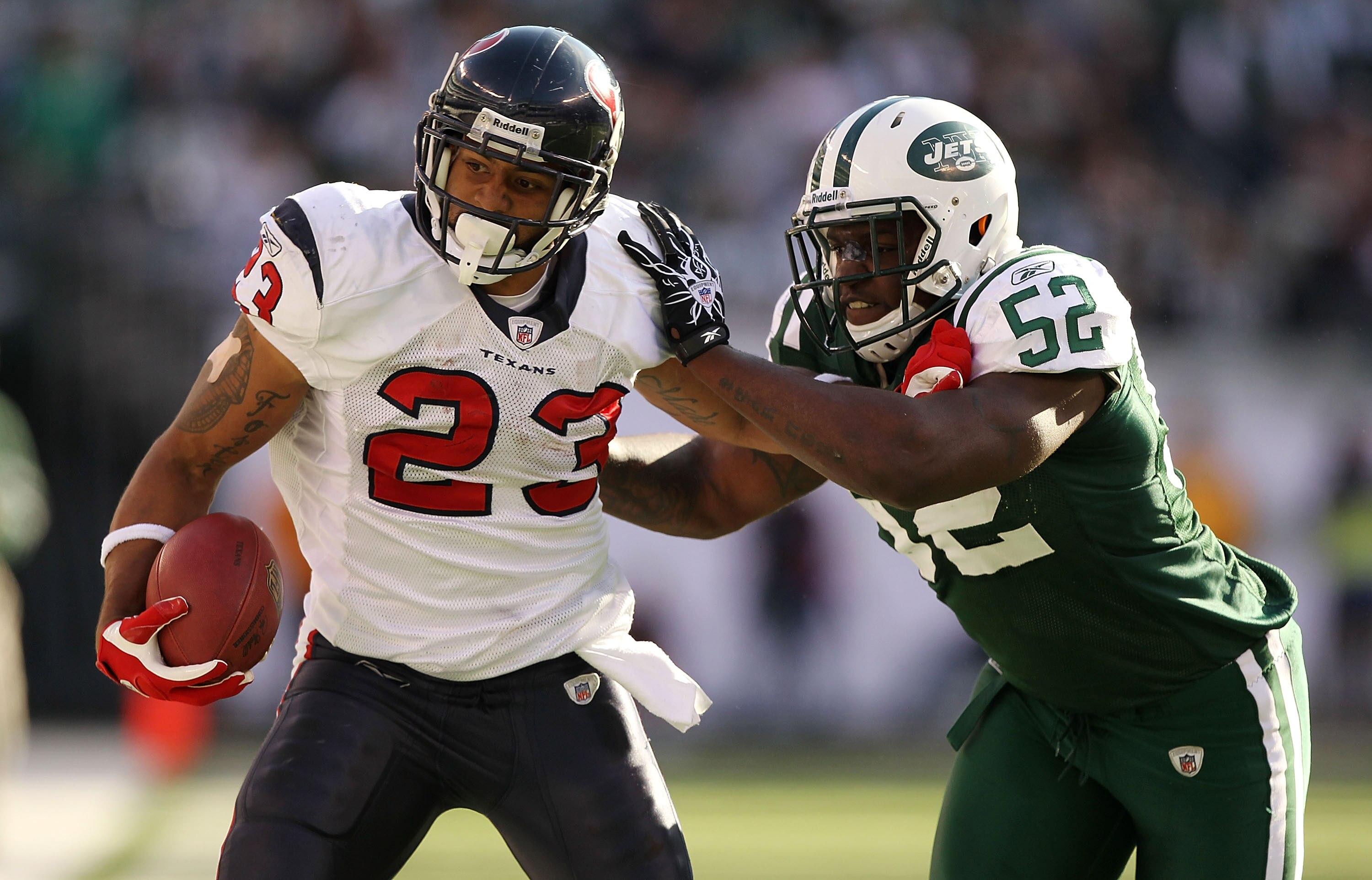 EAST RUTHERFORD, NJ - NOVEMBER 21:  Arian Foster #23 of the Houston Texans is tackled by David Harris #52 of  the New York Jets during their  game on November 21, 2010 at the New Meadowlands Stadium  in East Rutherford, New Jersey.  (Photo by Al Bello/Get