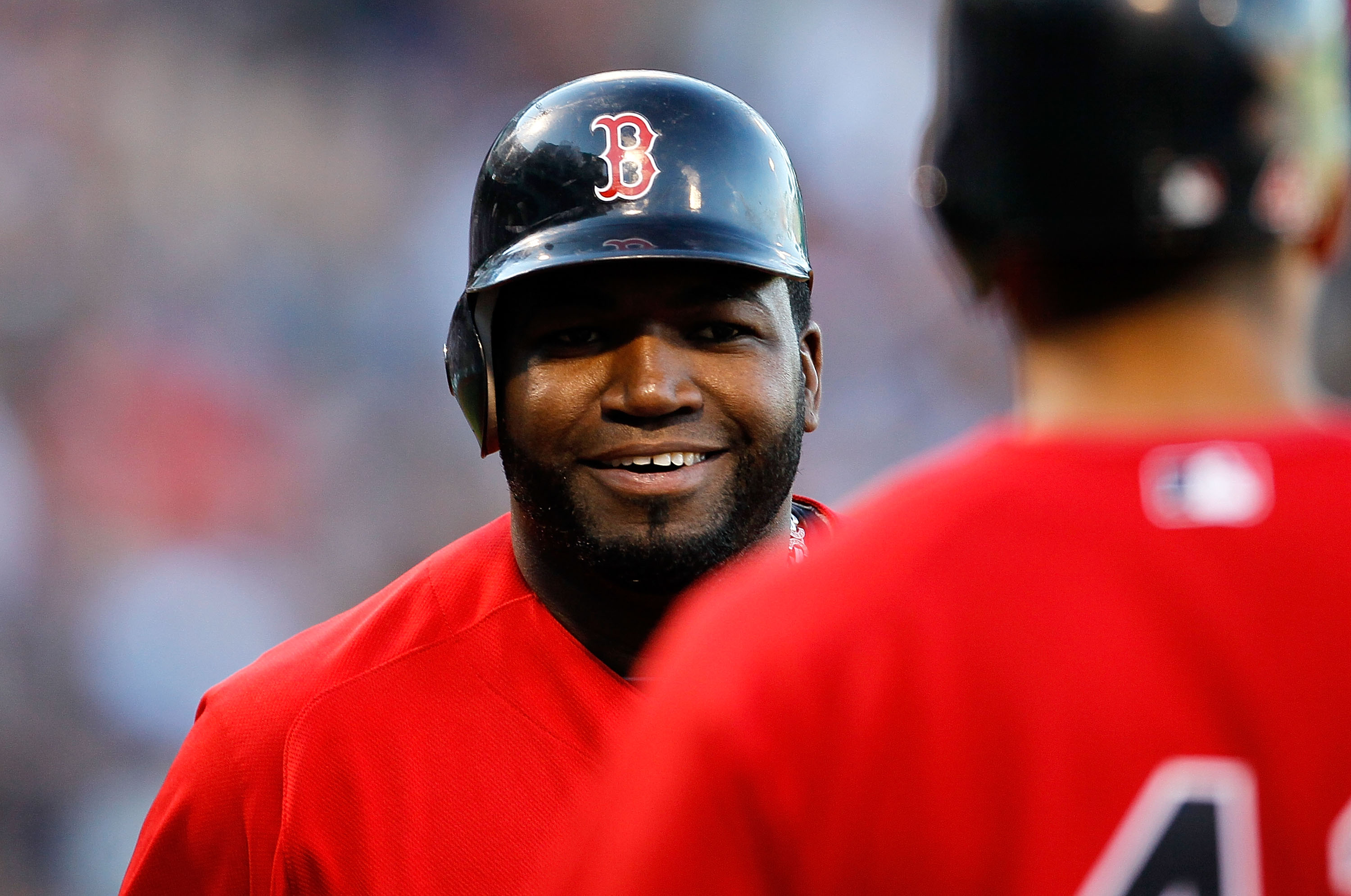 BOSTON - OCTOBER 2:  David Ortiz #34 of the Boston Red Sox smiles after scoring a run in the first inning during the first game of a doubleheader against the New York yankees at Fenway Park October 2, 2010 in Boston, Massachusetts. (Photo by Jim Rogash/Ge