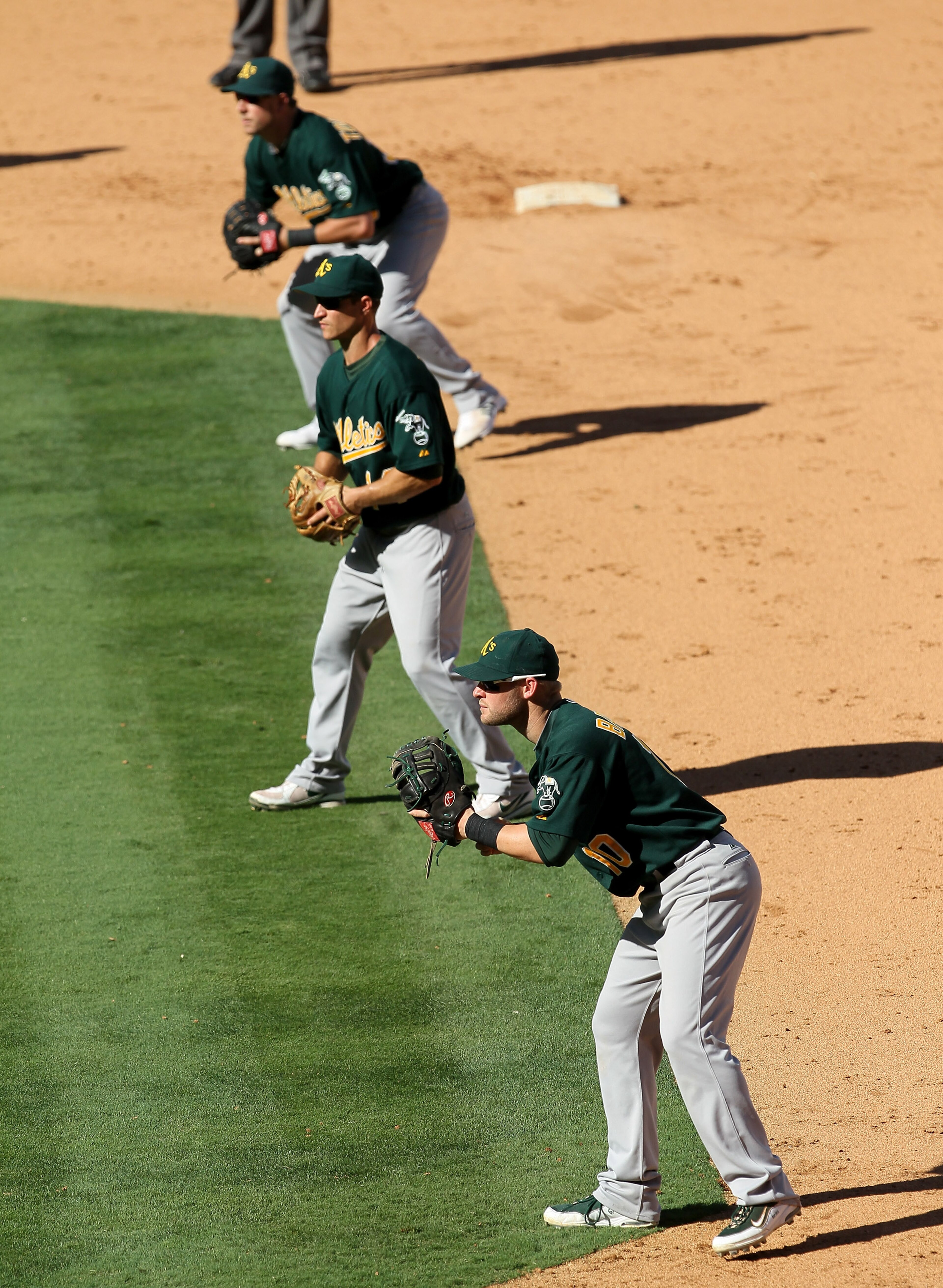 ANAHEIM, CA - SEPTEMBER 29: First baseman Daric Barton #14, second baseman Mark Ellis #14, and extra infielder Steven Tolleson #30 of the Oakland Athletics fill the right side of the infield as the Los Angeles Angels of Anaheim bat with the bases loaded, ANAHEIM, CA - SEPTEMBER 29: First baseman Daric Barton #14, second baseman Mark Ellis #14, and extra infielder Steven Tolleson #30 of the Oakland Athletics fill the right side of the infield as the Los Angeles Angels of Anaheim bat with the bases loaded,