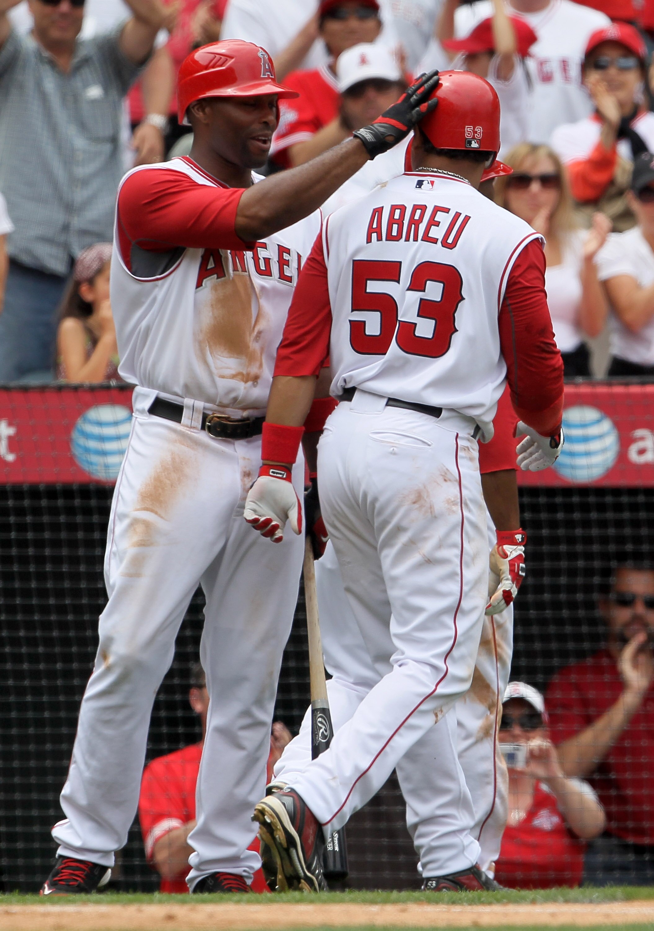 ANAHEIM, CA - MAY 16:  Bobby Abreu #53 of the Los Angeles Angels of Anaheim is congratulated by Torii Hunter #48 after hitting a two-run homerun in the sixth inning against the Oakland Athletics at Angel Stadium on May 16, 2010 in Anaheim, California. The