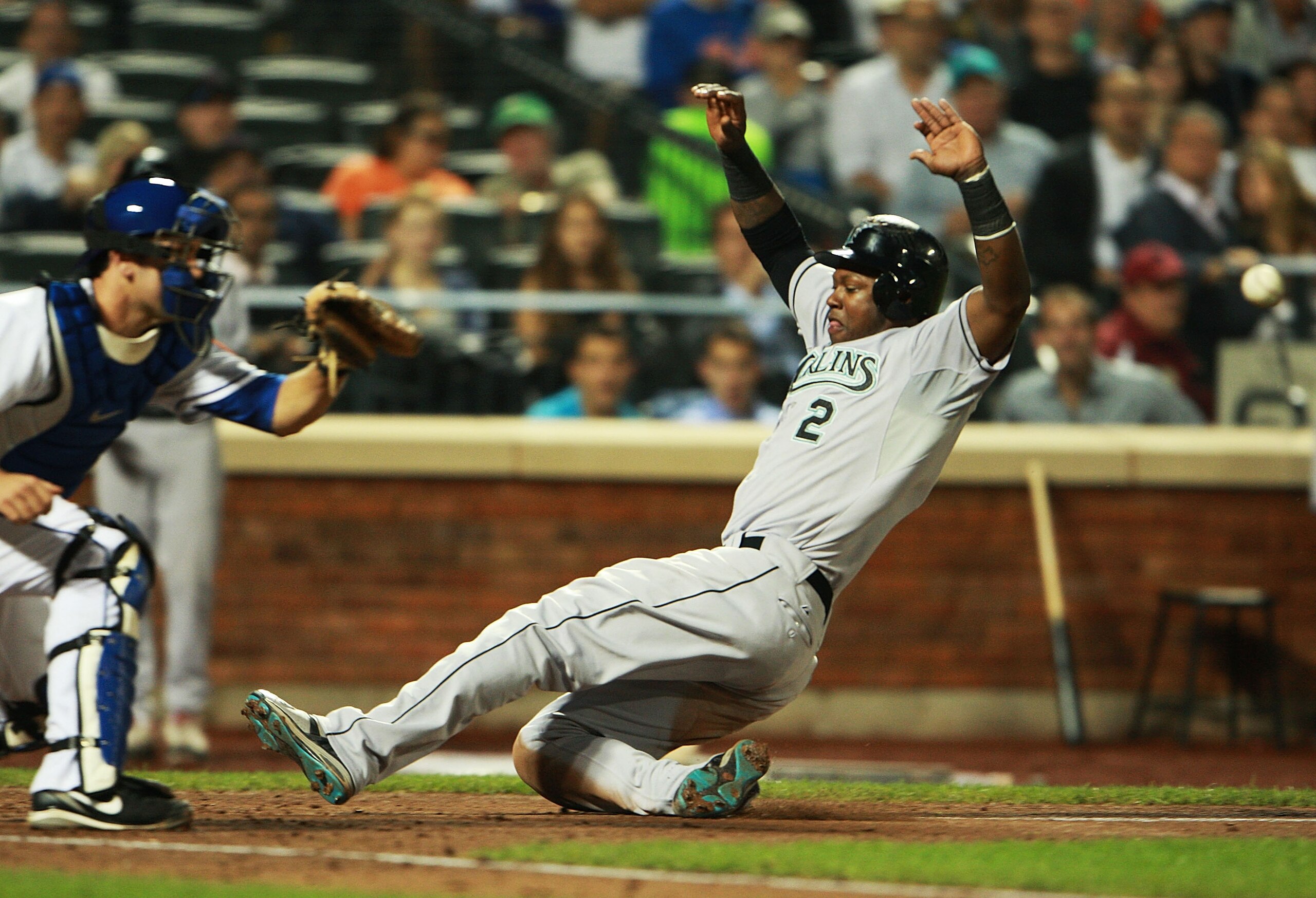 NEW YORK - AUGUST 25: Hanley Ramirez #2 of the Florida Marlins successfully slides into home off of Gaby Sanchez's #14 (not shown) sacrifice fly in the third inning on August 25, 2010 at Citi Field in the Flushing neighborhood of the Queens borough of Ne NEW YORK - AUGUST 25: Hanley Ramirez #2 of the Florida Marlins successfully slides into home off of Gaby Sanchez's #14 (not shown) sacrifice fly in the third inning on August 25, 2010 at Citi Field in the Flushing neighborhood of the Queens borough of Ne