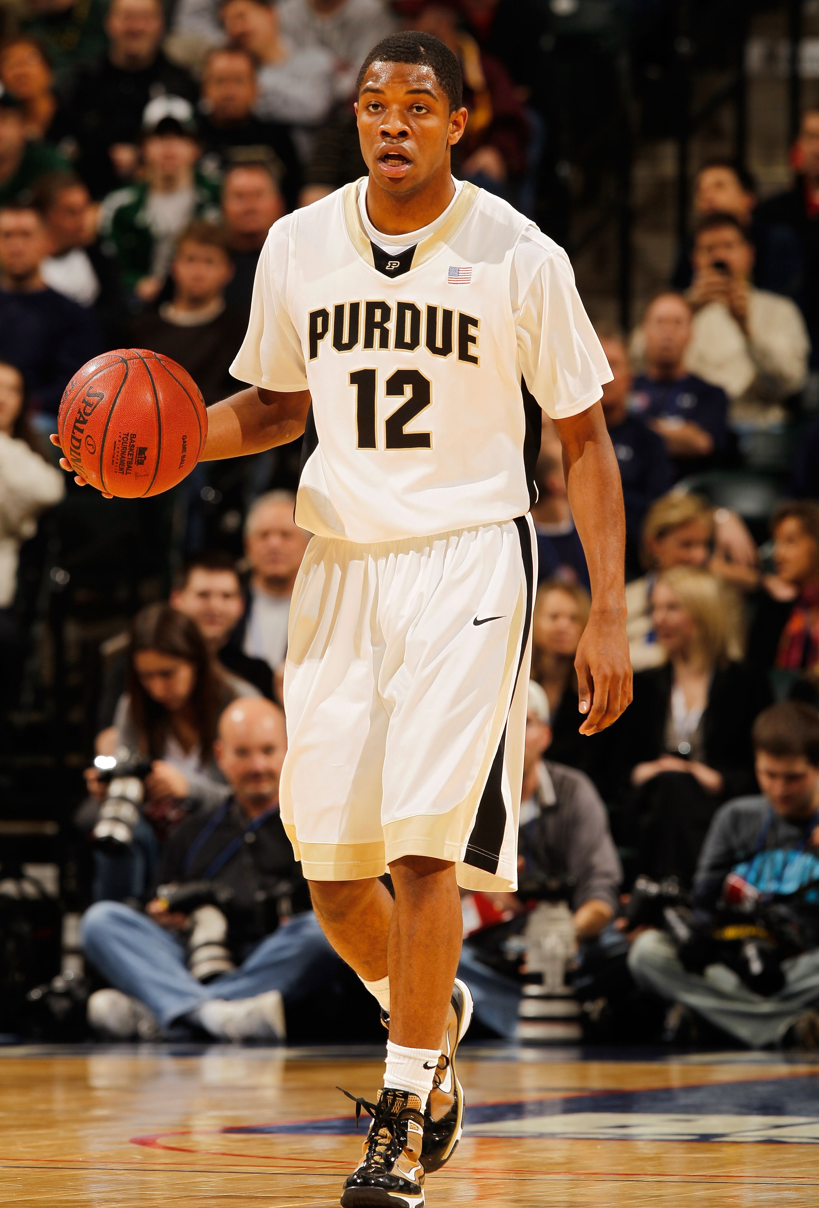 INDIANAPOLIS - MARCH 12:  Guard Kelsey Barlow #12 of the Purdue Boilermakers dribbles the ball against the Northwestern Wildcats during the quarterfinals of the Big Ten Men's Basketball Tournament at Conseco Fieldhouse on March 12, 2010 in Indianapolis, I