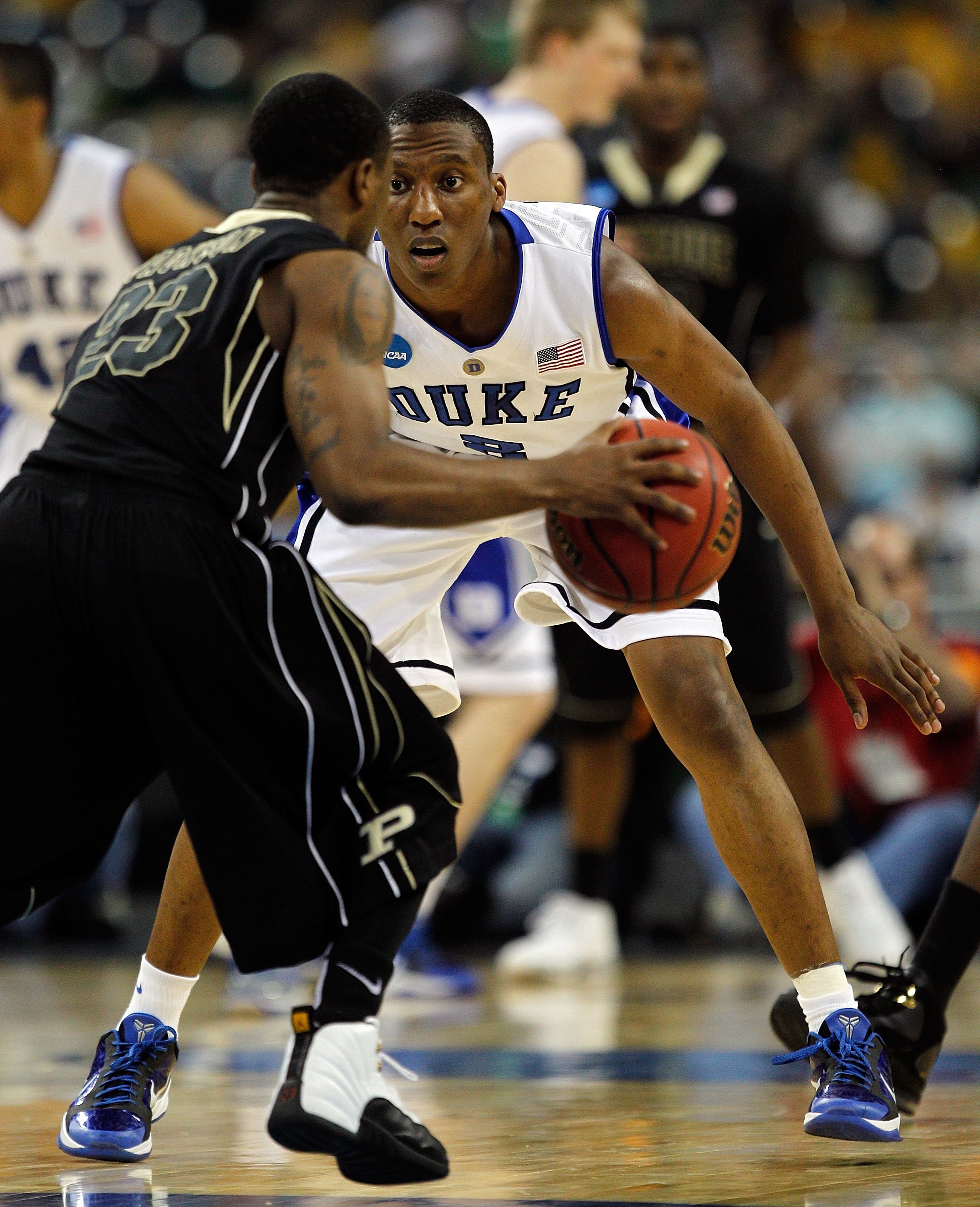HOUSTON - MARCH 26: Nolan Smith #2 of the Duke Blue Devils defends against Lewis Jackson #23 of the Purdue Boilermakers during the south regional semifinal of the 2010 NCAA men's basketball tournament at Reliant Stadium on March 26, 2010 in Houston, Texas