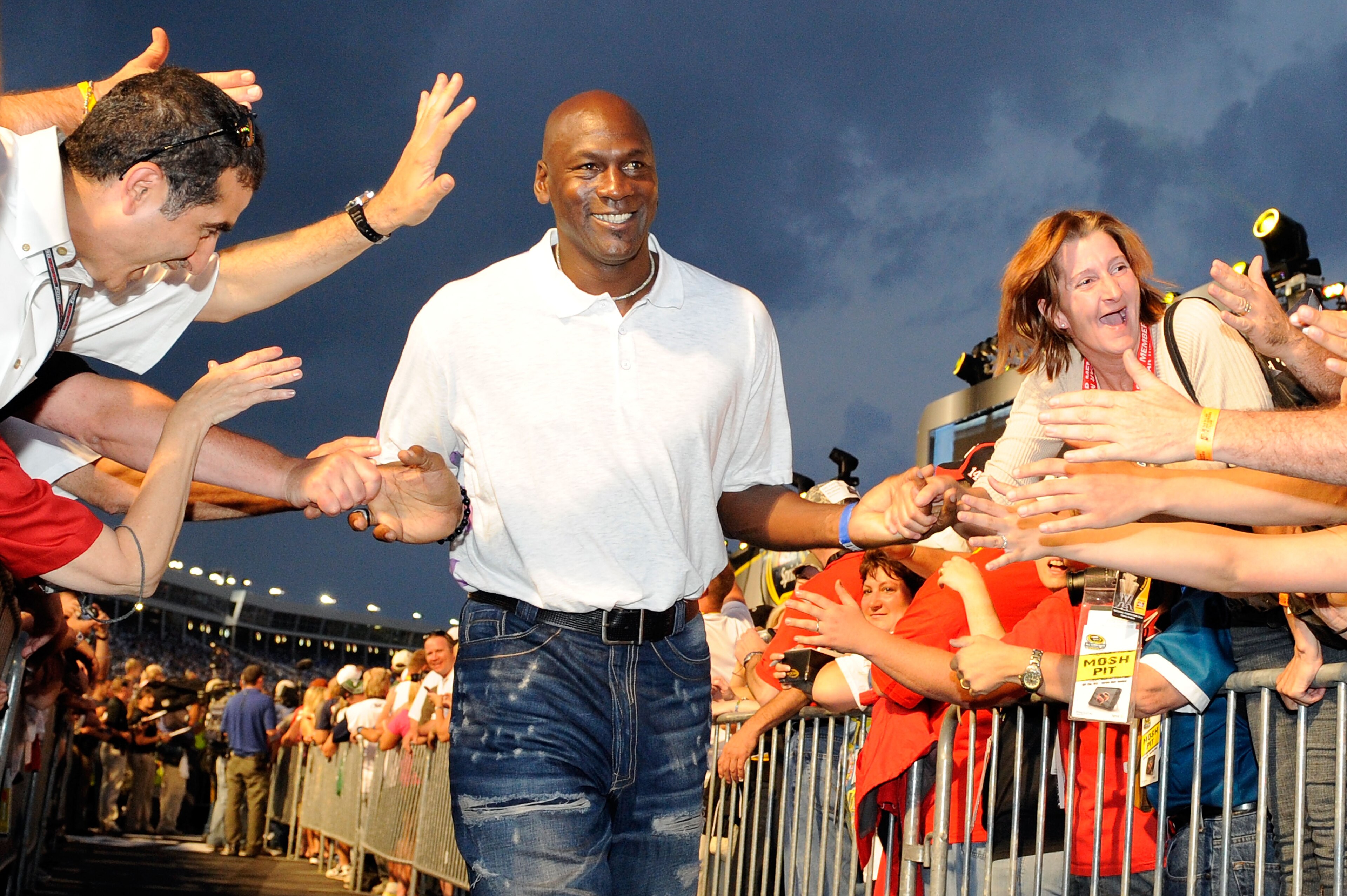 CONCORD, NC - MAY 22: Former NBA Chicago Bulls gaurd Michael Jordon high-fives the crowd during pre-race ceremonies prior to the start of the NASCAR Sprint All-Star Race at Charlotte Motor Speedway on May 22, 2010 in Concord, North Carolina. (Photo by J CONCORD, NC - MAY 22: Former NBA Chicago Bulls gaurd Michael Jordon high-fives the crowd during pre-race ceremonies prior to the start of the NASCAR Sprint All-Star Race at Charlotte Motor Speedway on May 22, 2010 in Concord, North Carolina. (Photo by J
