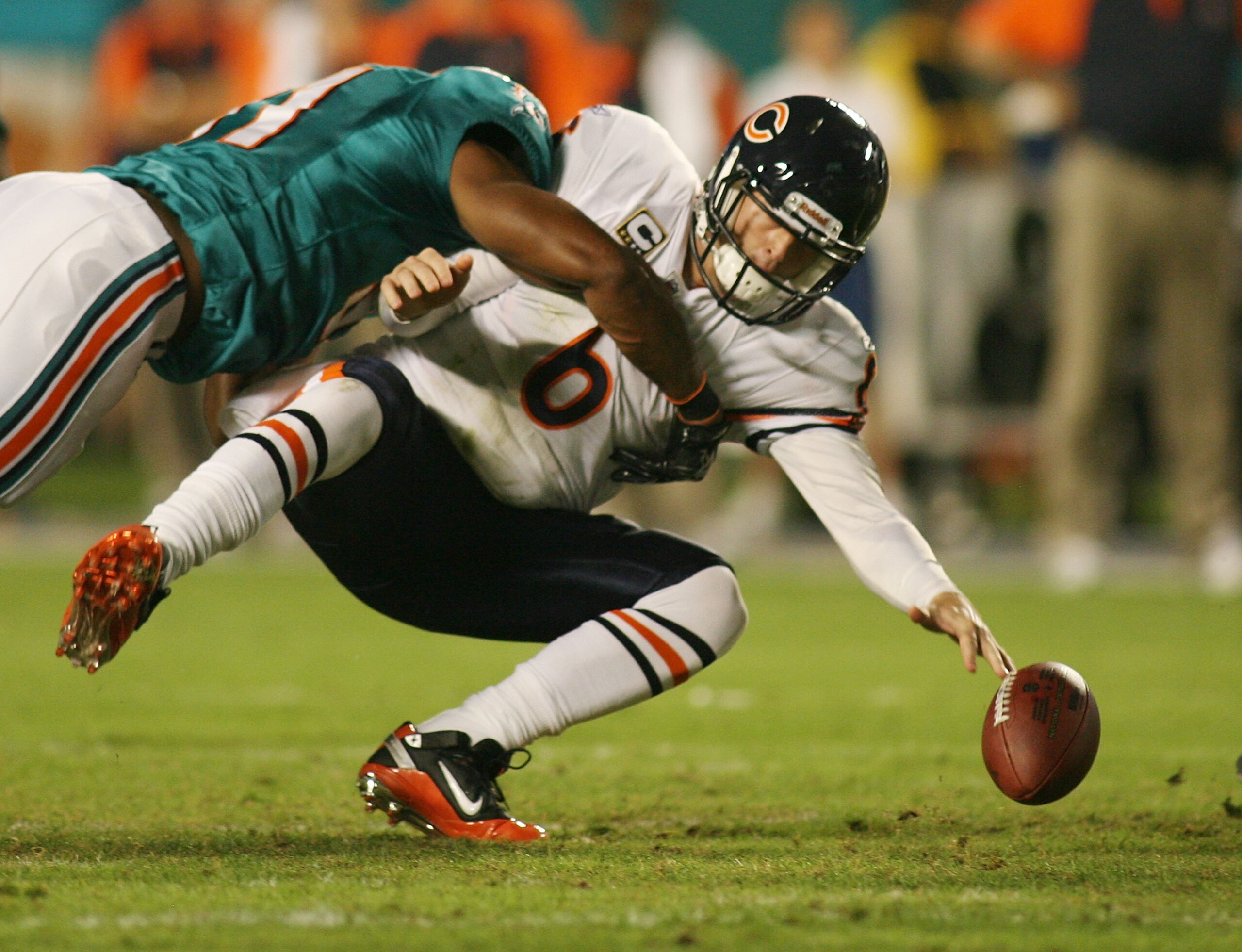 MIAMI - NOVEMBER 18: Quarterback Jay Cutler #6 of the Chicago Bears is sacked by linebacker Cameron wake #91 of the Miami Dolphins and fumbles at Sun Life Stadium on November 18, 2010 in Miami, Florida.  (Photo by Marc Serota/Getty Images)
