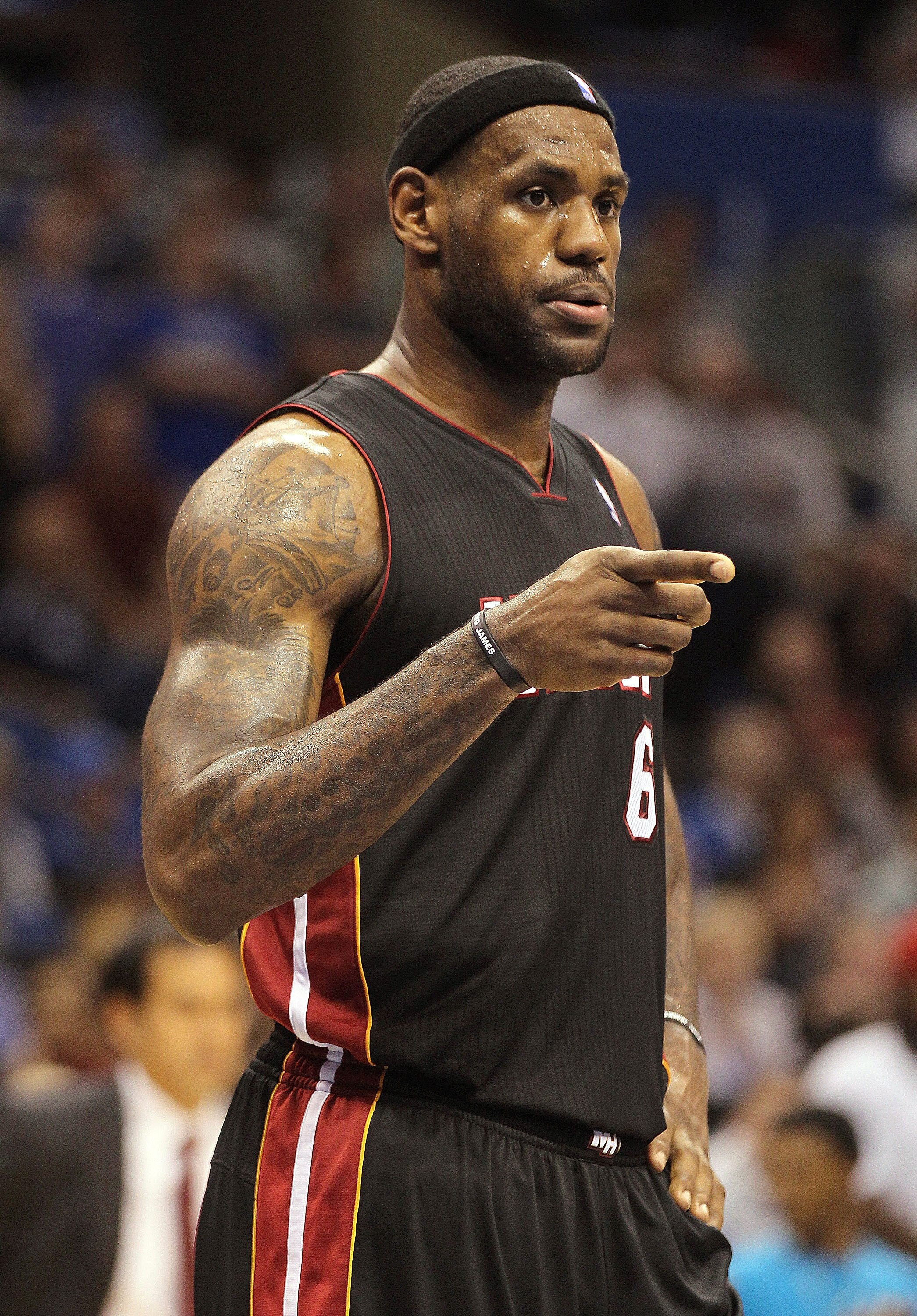 ORLANDO, FL - NOVEMBER 24:  LeBron James #6 of the Miami Heat points to his defender during a game against the Orlando Magic at Amway Arena on November 24, 2010 in Orlando, Florida. NOTE TO USER: User expressly acknowledges and agrees that, by downloading