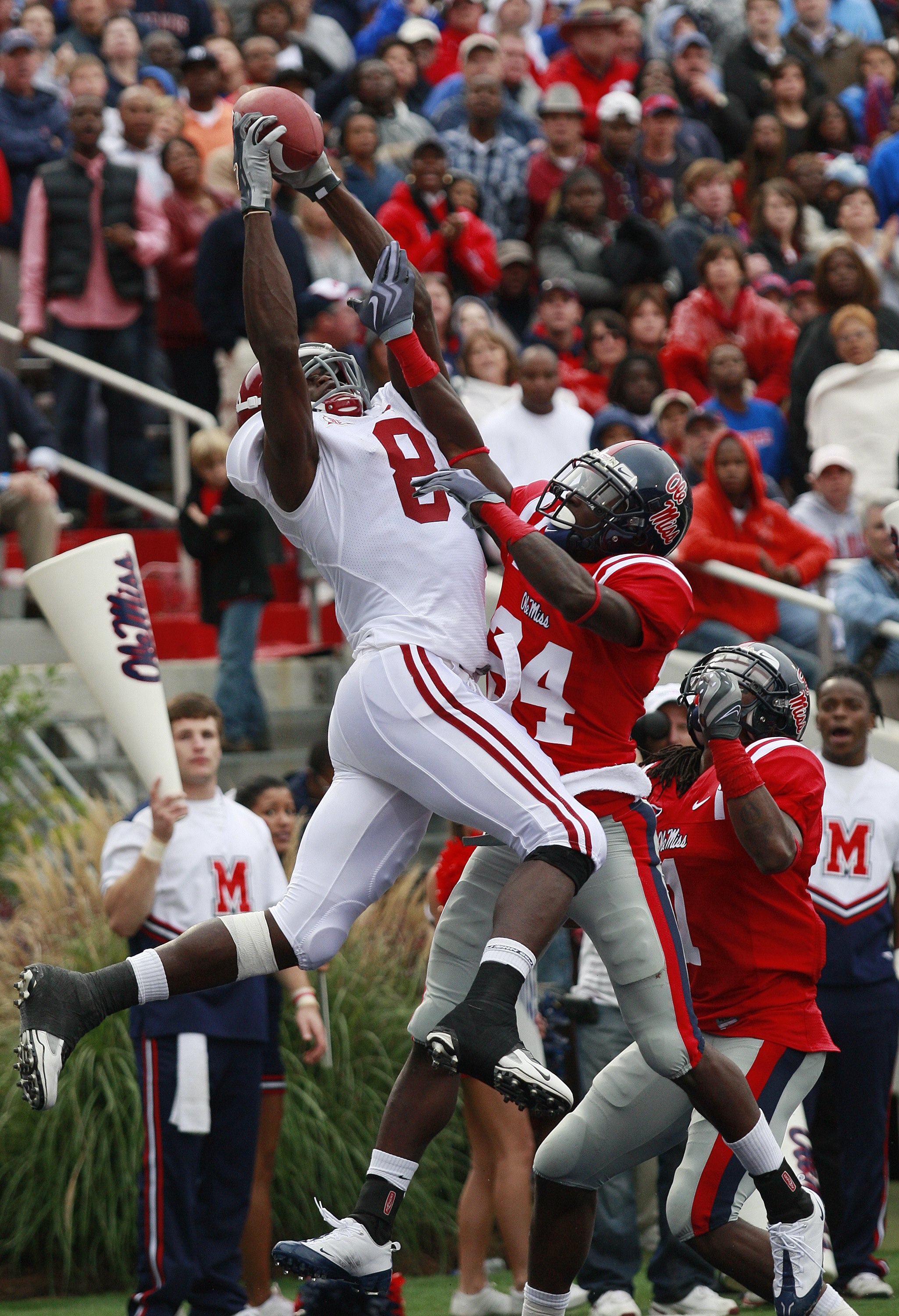OXFORD, MS - OCTOBER 10:  Julio Jones #8 of the Alabama Crimson Tide has his reception broken up by Kendrick Lewis #1 and Cassius Vaughn #24 of the Mississippi Rebels during their college football game at Vaught-Hemingway Stadium on October 10, 2009 in Ox