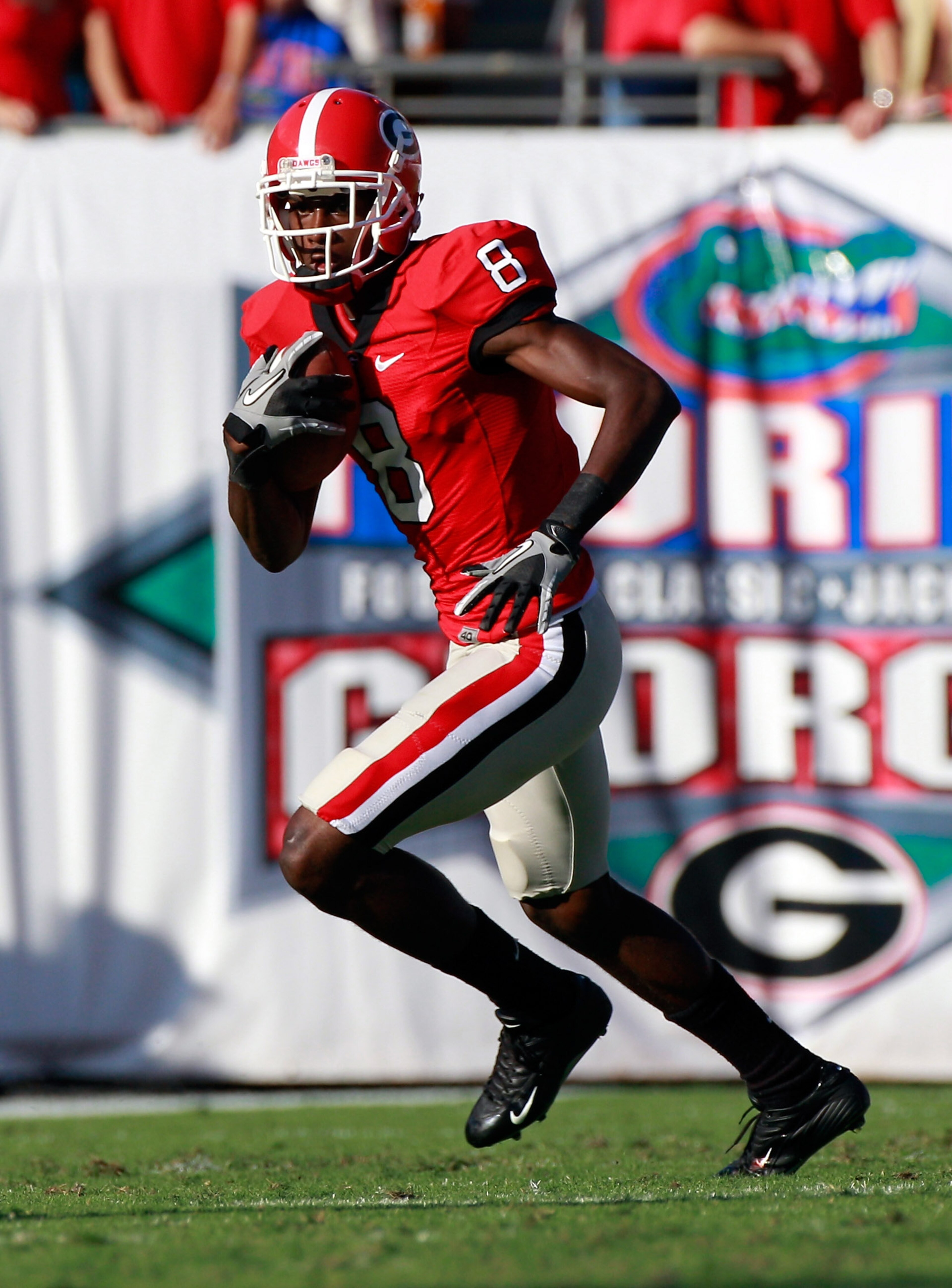JACKSONVILLE, FL - OCTOBER 30:  A.J. Green #8 of the Georgia Bulldogs runs for yardage during the game against the Florida Gators at EverBank Field on October 30, 2010 in Jacksonville, Florida.  (Photo by Sam Greenwood/Getty Images)