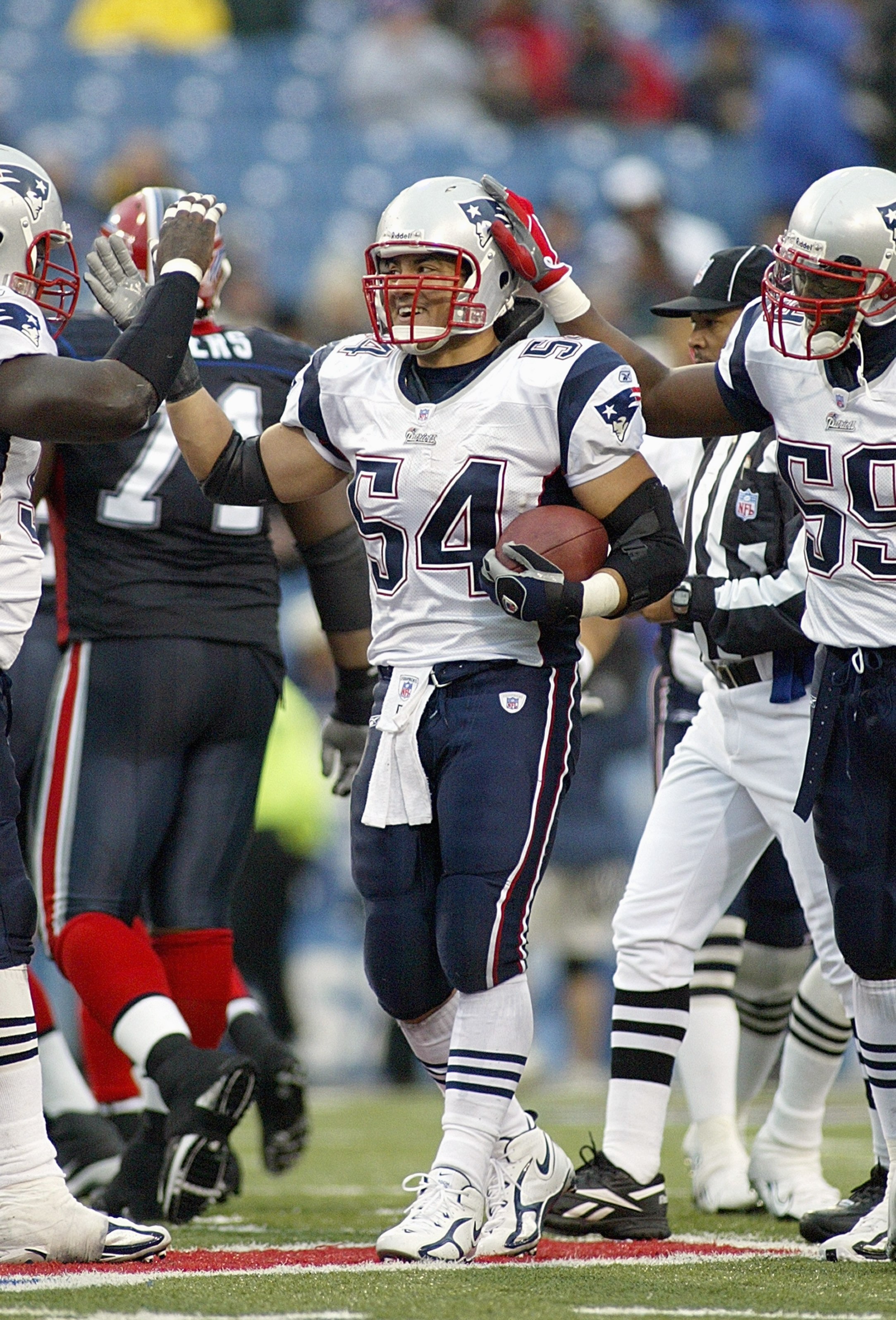 ORCHARD PARK, NY - OCTOBER 22:  Teddy Bruschi #54 of the New England Patriots celebrates during the game against the Buffalo Bills on October 22, 2006 at Ralph Wilson Stadium in Orchard Park, New York. (Photo by Rick Stewart/Getty Images)