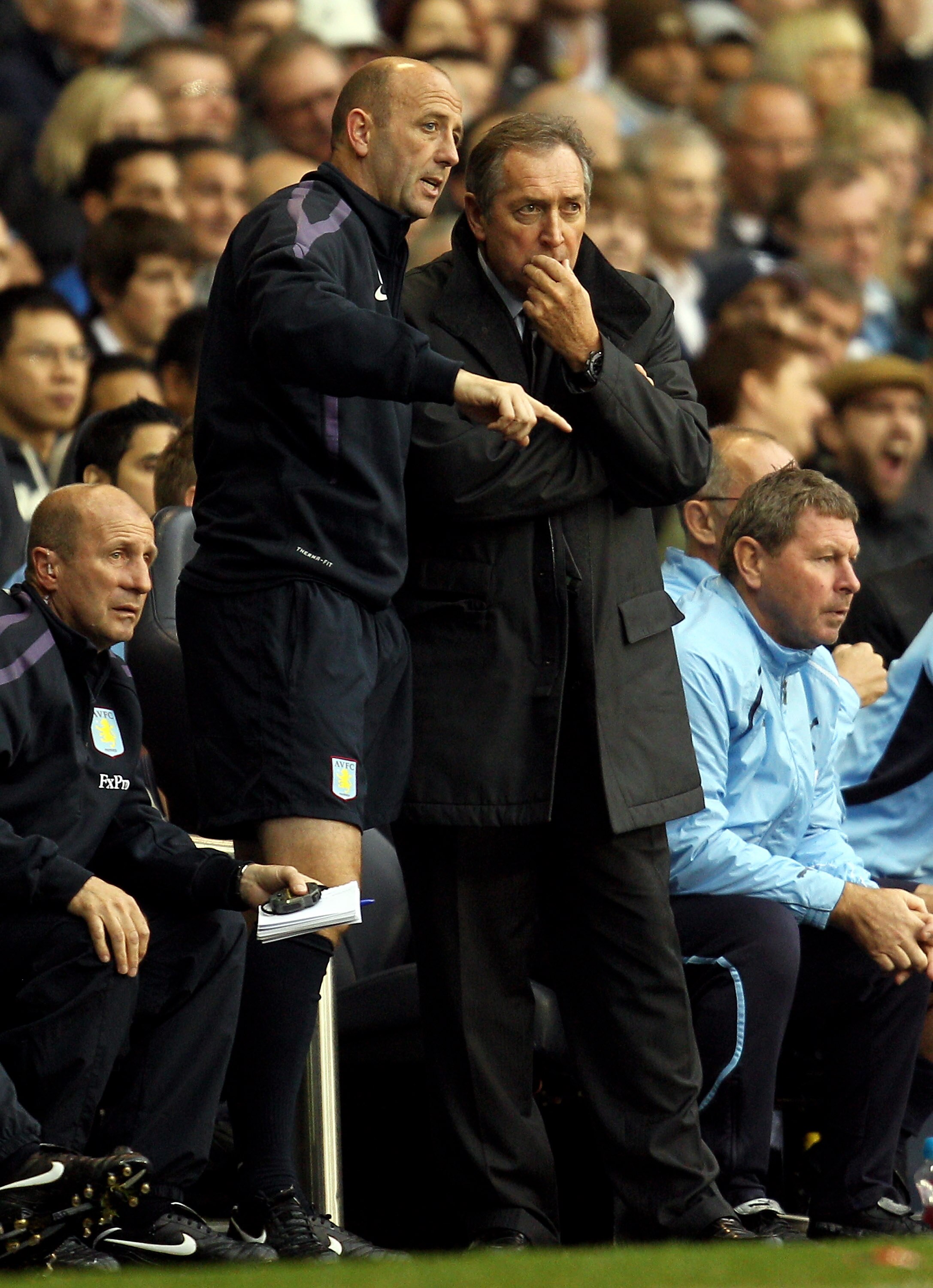 LONDON, ENGLAND - OCTOBER 02: Aston Villa first-team coach Gary McAllister speaks to Manager Gerard Houllier during the Barclays Premier League match between Tottenham Hotspur and Aston Villa at White Hart Lane on October 2, 2010 in London, England.  (Pho