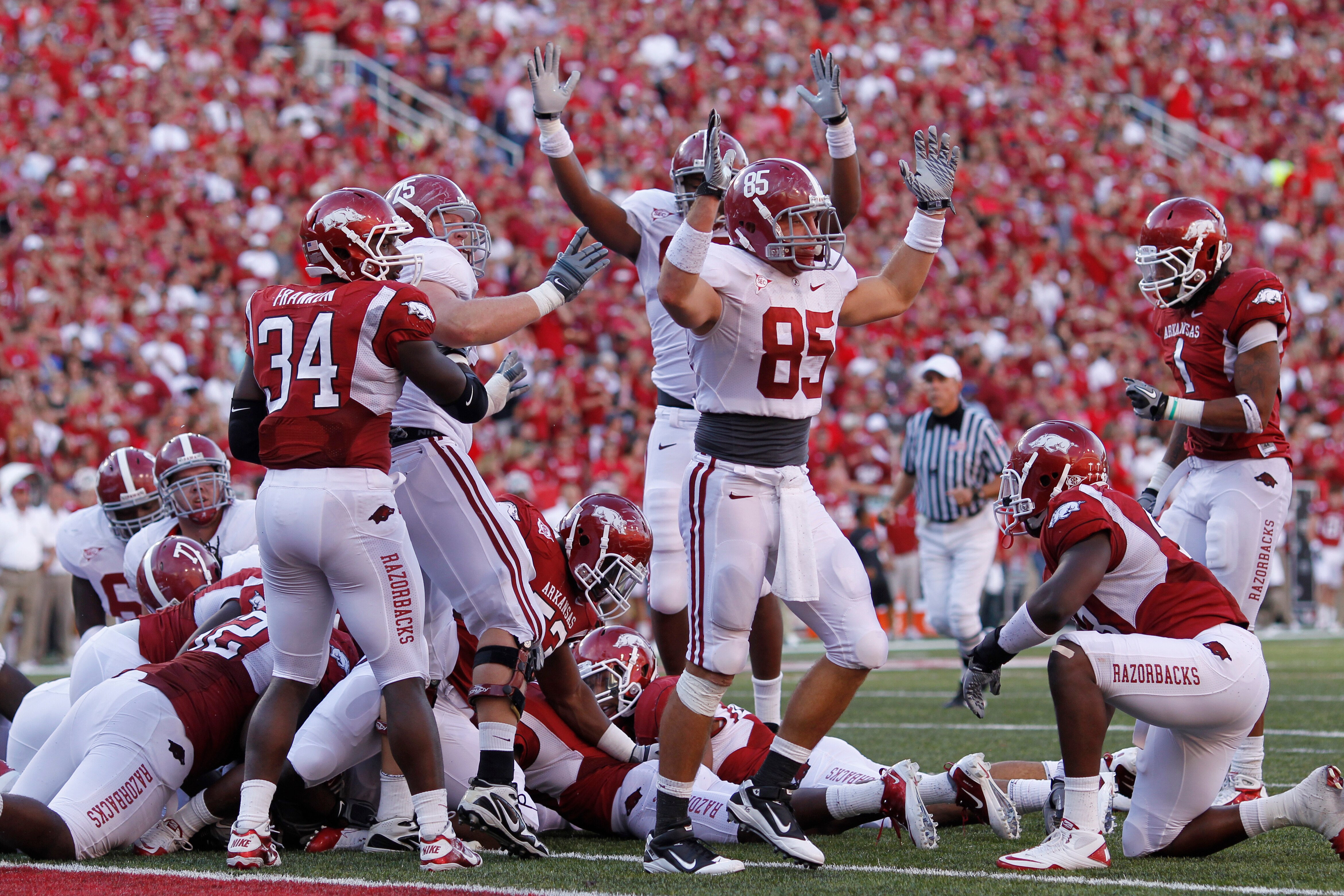 FAYETTEVILLE - SEPTEMBER 25: Alabama Crimson Tide players celebrate after Mark Ingram (not pictured) scored the game winning touchdown against the Arkansas Razorbacks at Donald W. Reynolds Razorback Stadium on September 25, 2010 in Fayetteville, Arkansas.