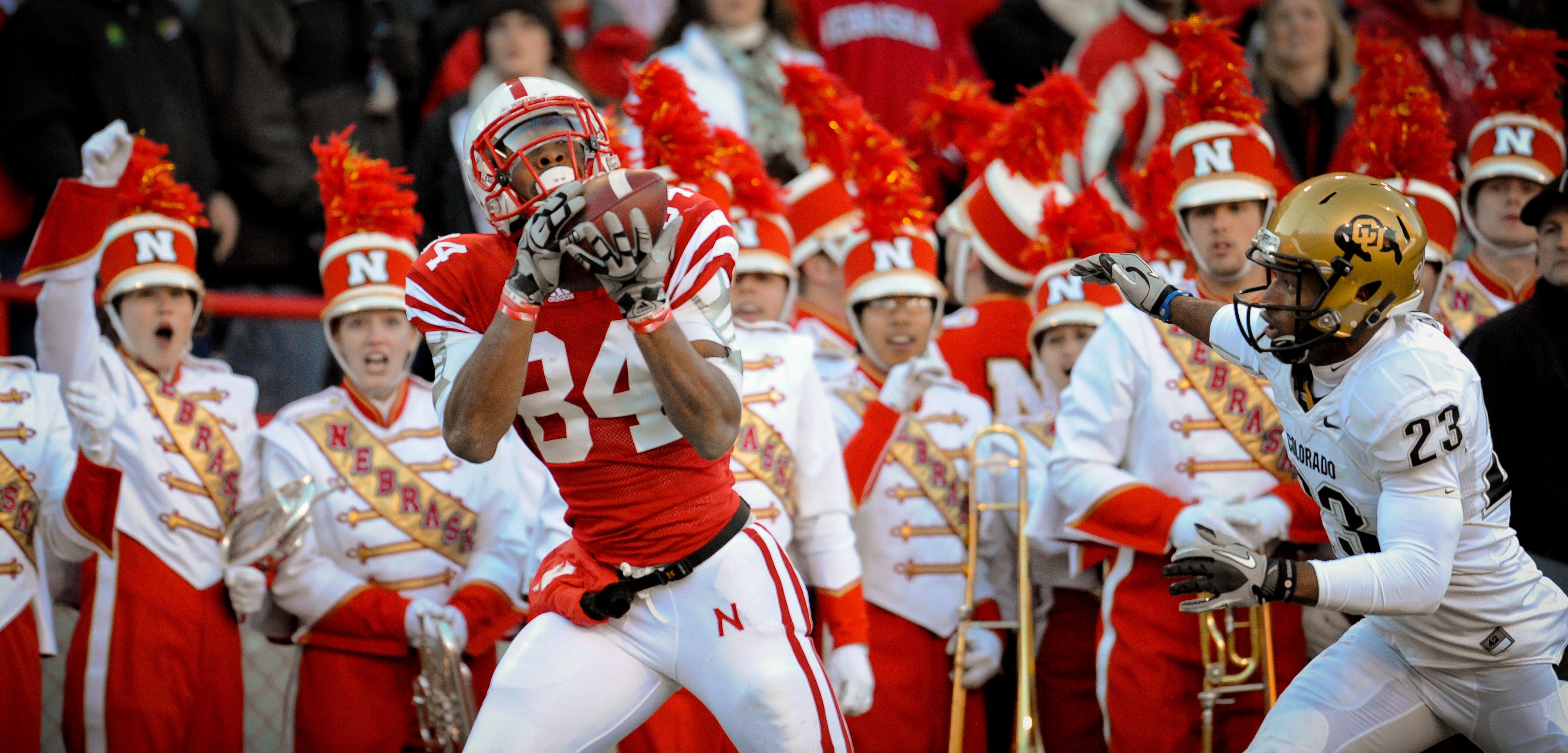 LINCOLN, NE - NOVEMBER 26: Brandon Kinnie #84 of the Nebraska Cornhuskers catches a touchdown over Jalil Brown #23 of the Colorado Buffaloes during the first half of their game at Memorial Stadium on November 26, 2010 in Lincoln, Nebraska.  Nebraska defea