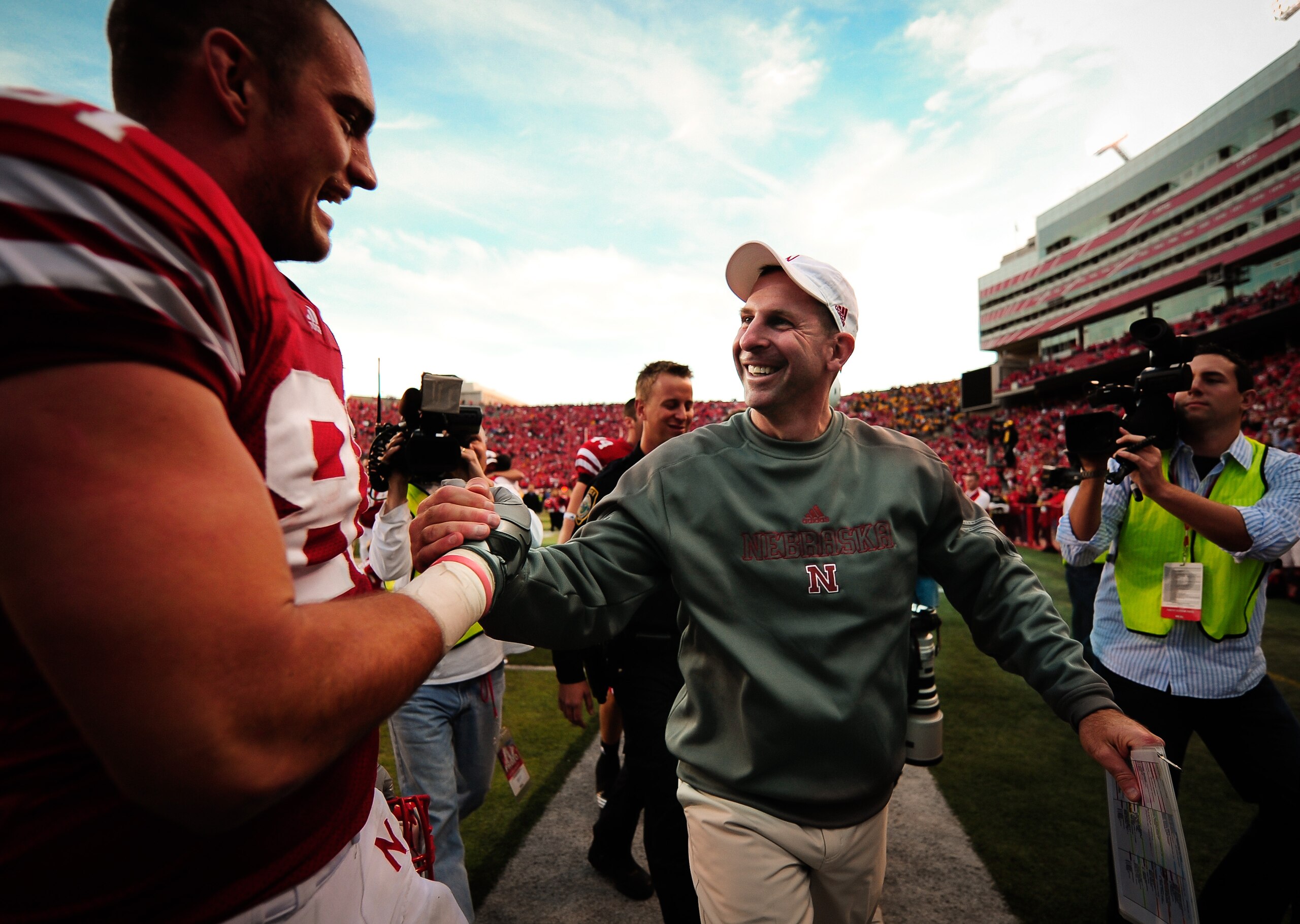 LINCOLN, NE - OCTOBER 30: Coach Bo Pelini of the Nebraska Cornhuskers high fives tight end Ben Cotton #81 after their game against the Missouri Tigers at Memorial Stadium on October 30, 2010 in Lincoln, Nebraska. Nebraska Defeated Missouri 31-17. (Photo b LINCOLN, NE - OCTOBER 30: Coach Bo Pelini of the Nebraska Cornhuskers high fives tight end Ben Cotton #81 after their game against the Missouri Tigers at Memorial Stadium on October 30, 2010 in Lincoln, Nebraska. Nebraska Defeated Missouri 31-17. (Photo b