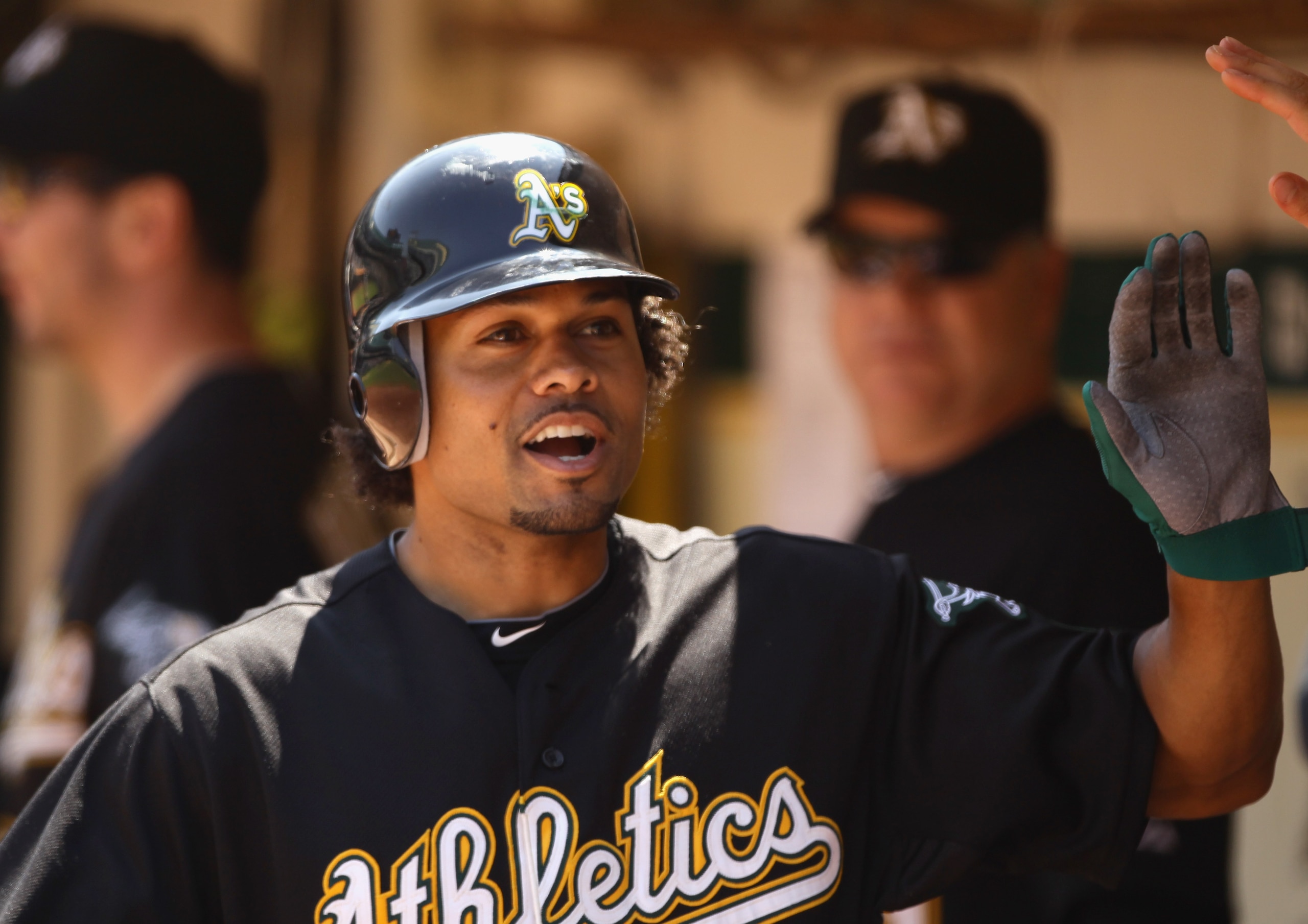 OAKLAND, CA - AUGUST 07:  Coco Crisp #4 of the Oakland Athletics is congratulated by teammates after he hit a home run in the second inning to give the Athletics a 3-0 lead over the Texas Rangers at the Oakland-Alameda County Coliseum on August 7, 2010 in