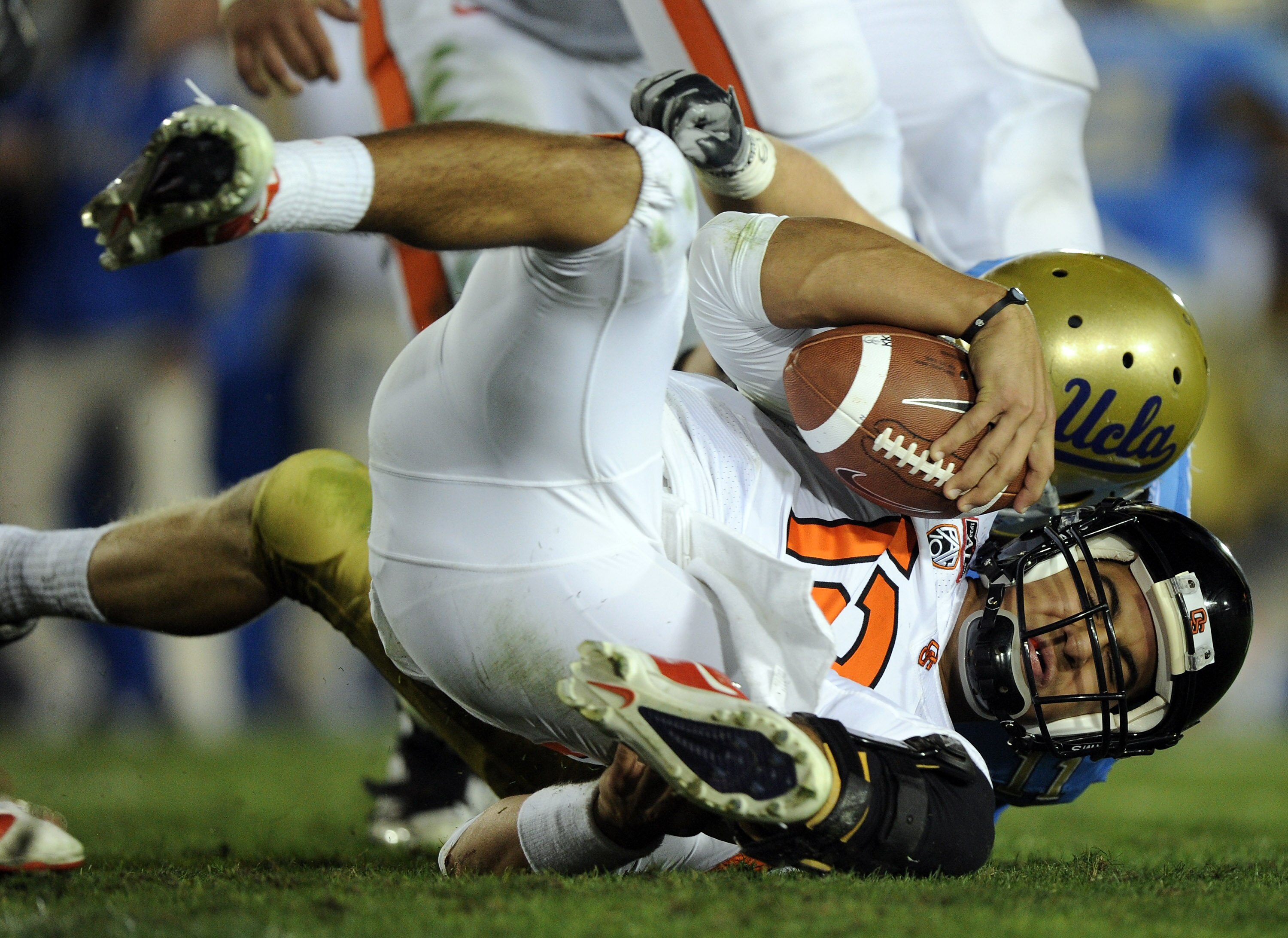 PASADENA, CA - NOVEMBER 06:  Ryan Katz #12 of the Oregon State Beavers is sacked by Sean Westgate #11 of the UCLA Bruins during the fourth quarter at the Rose Bowl on November 6, 2010 in Pasadena, California.  (Photo by Harry How/Getty Images)