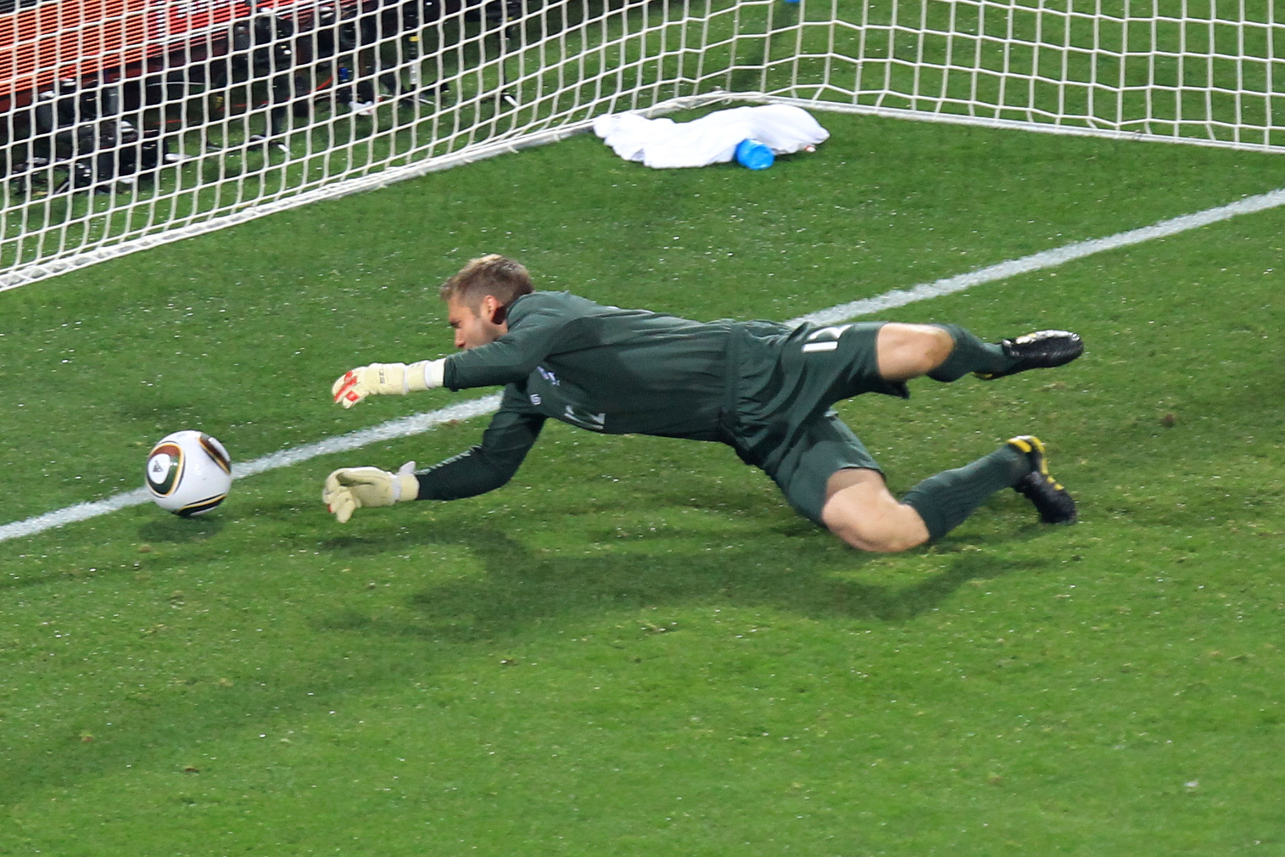 RUSTENBURG, SOUTH AFRICA - JUNE 12: Robert Green of England misjudges the ball and lets in a goal during the 2010 FIFA World Cup South Africa Group C match between England and USA at the Royal Bafokeng Stadium on June 12, 2010 in Rustenburg, South Africa RUSTENBURG, SOUTH AFRICA - JUNE 12: Robert Green of England misjudges the ball and lets in a goal during the 2010 FIFA World Cup South Africa Group C match between England and USA at the Royal Bafokeng Stadium on June 12, 2010 in Rustenburg, South Africa