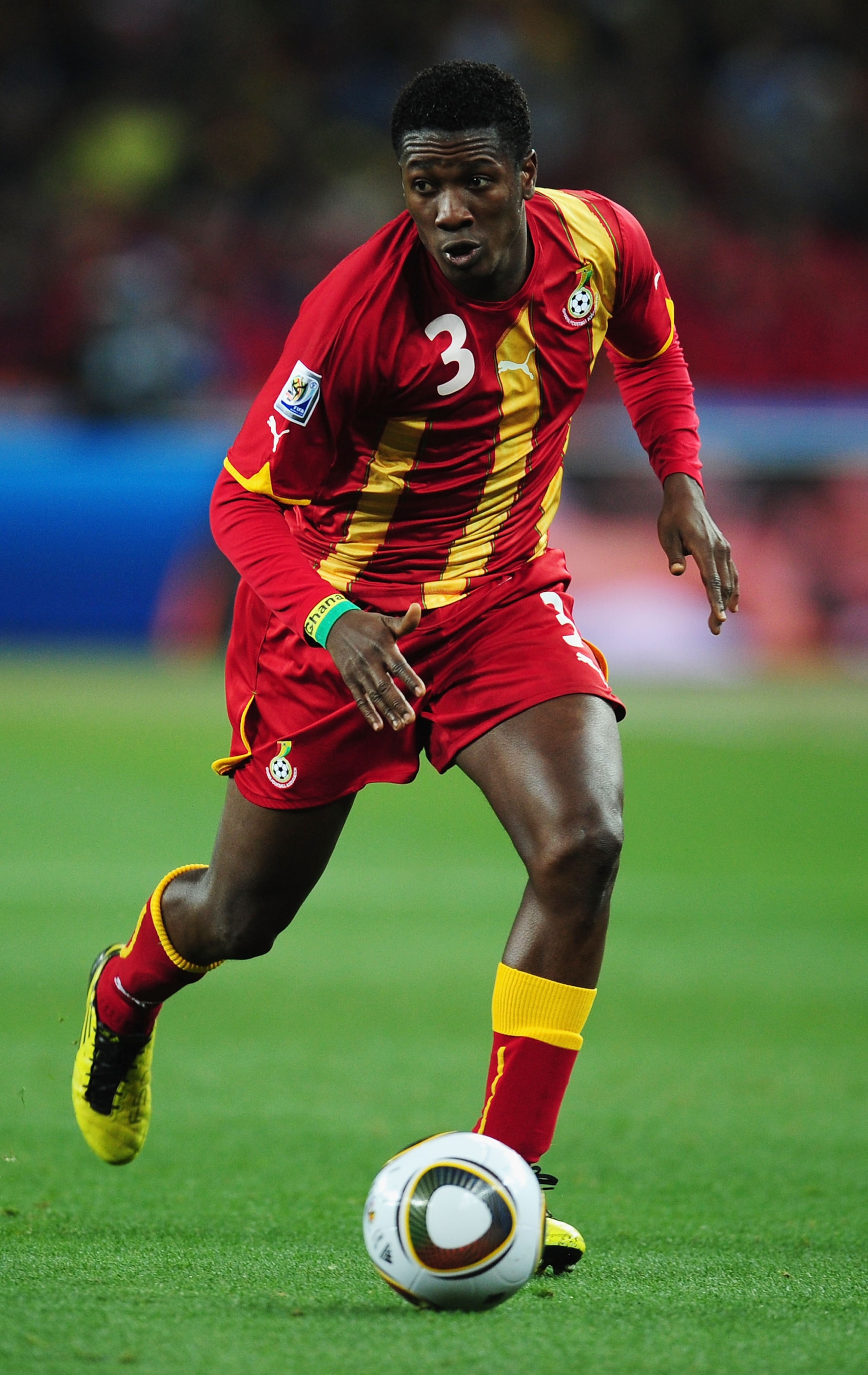 JOHANNESBURG, SOUTH AFRICA - JULY 02: Asamoah Gyan of Ghana runs with the ball during the 2010 FIFA World Cup South Africa Quarter Final match between Uruguay and Ghana at the Soccer City stadium on July 2, 2010 in Johannesburg, South Africa. (Photo by JOHANNESBURG, SOUTH AFRICA - JULY 02: Asamoah Gyan of Ghana runs with the ball during the 2010 FIFA World Cup South Africa Quarter Final match between Uruguay and Ghana at the Soccer City stadium on July 2, 2010 in Johannesburg, South Africa. (Photo by