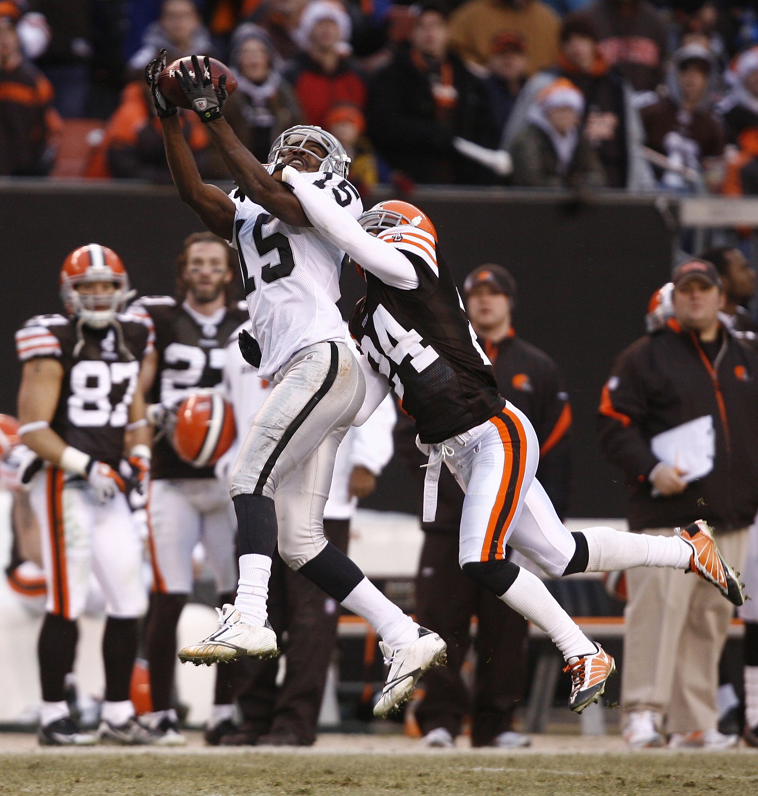CLEVELAND - DECEMBER 27: Johnnie Lee Higgins #15 of the Oakland Raiders makes a catch over Eric Wright #24 of the Cleveland Browns at Cleveland Browns Stadium on December 27, 2009 in Cleveland, Ohio. (Photo by Matt Sullivan/Getty Images) CLEVELAND - DECEMBER 27: Johnnie Lee Higgins #15 of the Oakland Raiders makes a catch over Eric Wright #24 of the Cleveland Browns at Cleveland Browns Stadium on December 27, 2009 in Cleveland, Ohio. (Photo by Matt Sullivan/Getty Images)