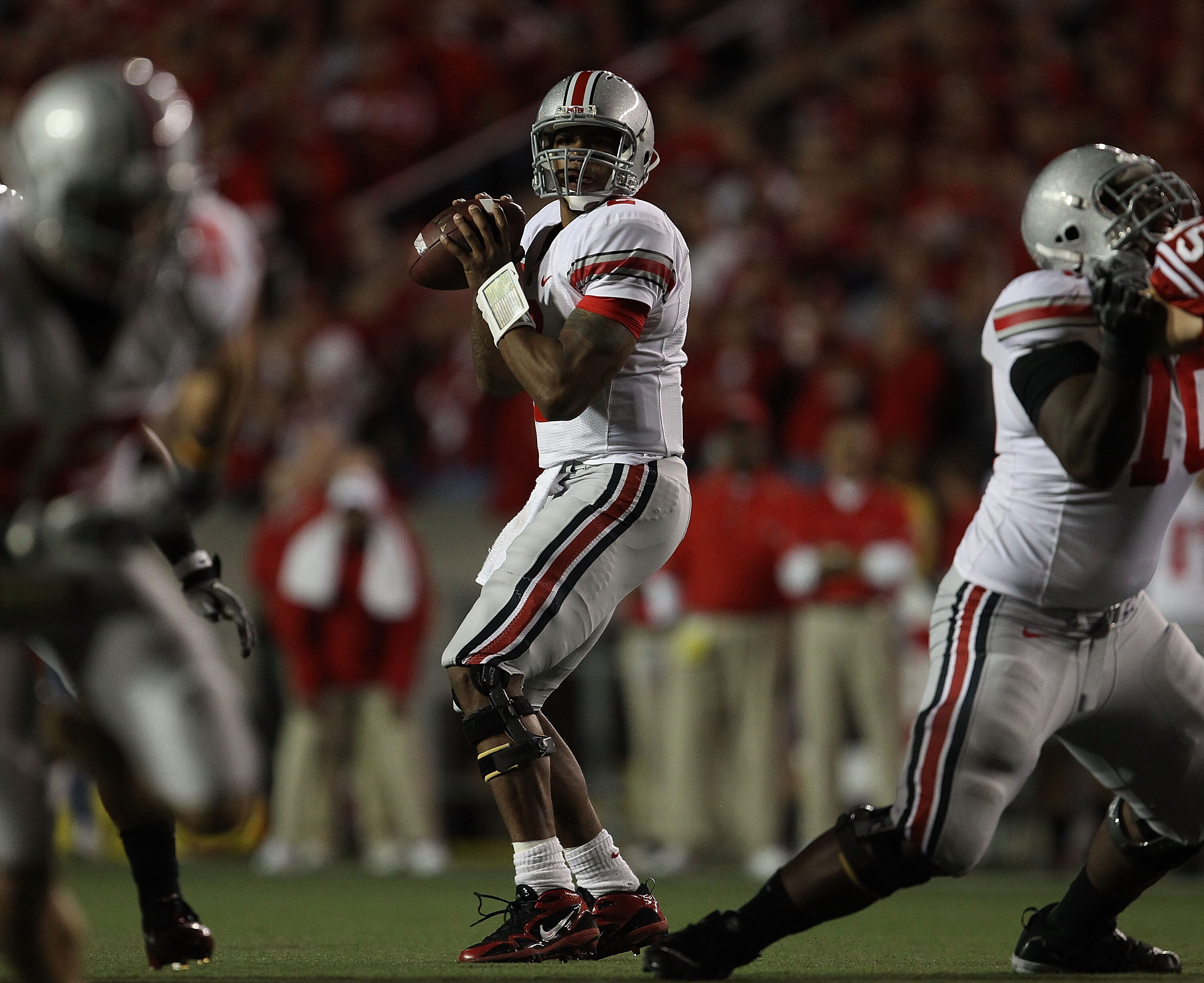 MADISON, WI - OCTOBER 16: Terrelle Pryor #2 of the Ohio State Buckeyes looks for a receiver against the Wisconsin Badgers at Camp Randall Stadium on October 16, 2010 in Madison, Wisconsin. Wisconsin defeated Ohio State 31-18. (Photo by Jonathan Daniel/Get
