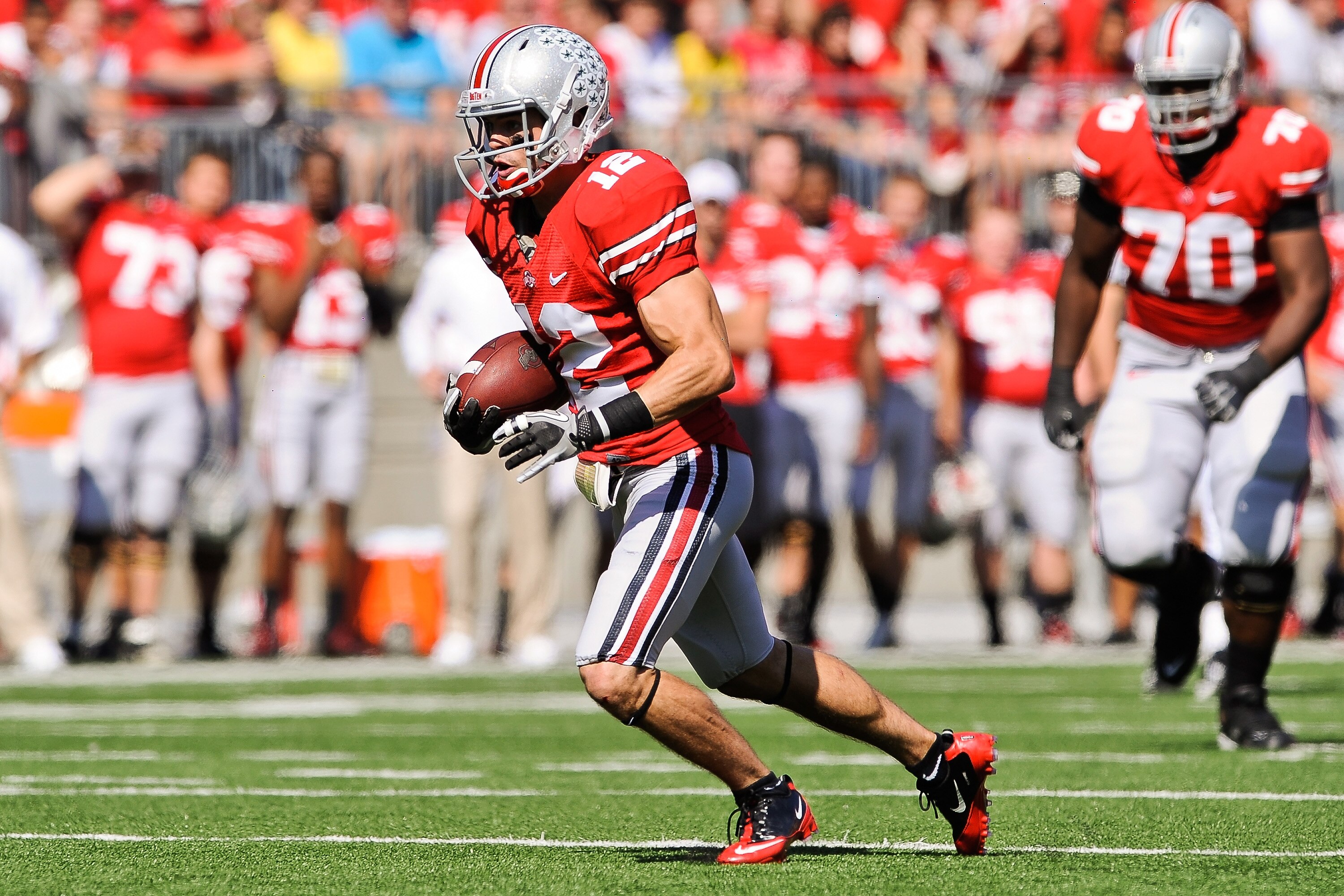 COLUMBUS, OH - OCTOBER 9:  Dane Sanzenbacher #12 of the Ohio State Buckeyes runs with the ball against the Indiana Hoosiers at Ohio Stadium on October 9, 2010 in Columbus, Ohio.  (Photo by Jamie Sabau/Getty Images)