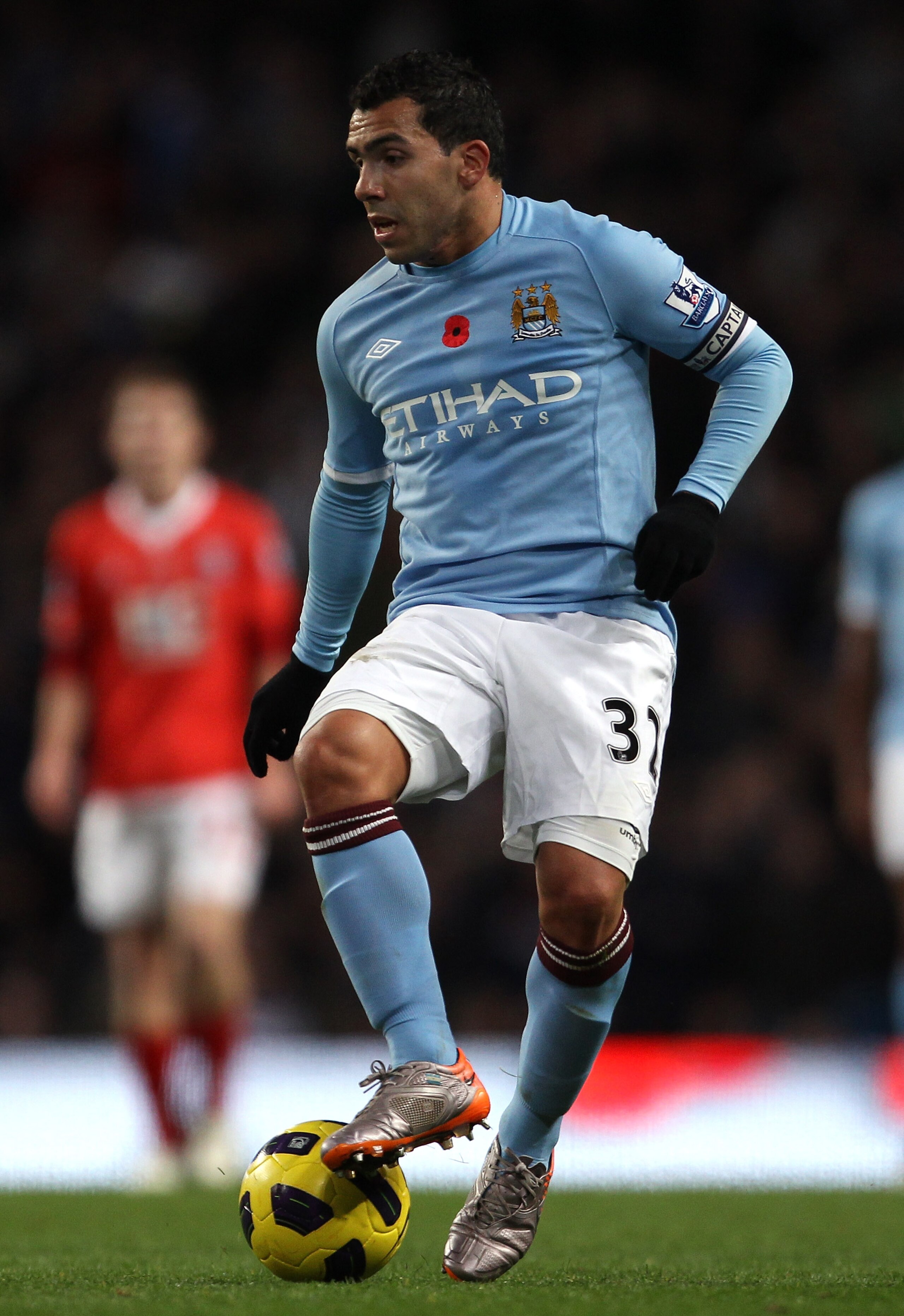 MANCHESTER, ENGLAND - NOVEMBER 13:  Carlos Tevez of Manchester City controls the ball during the Barclays Premier League match between Manchester City and Birmingham City at City of Manchester Stadium on November 13, 2010 in Manchester, England.  (Photo b