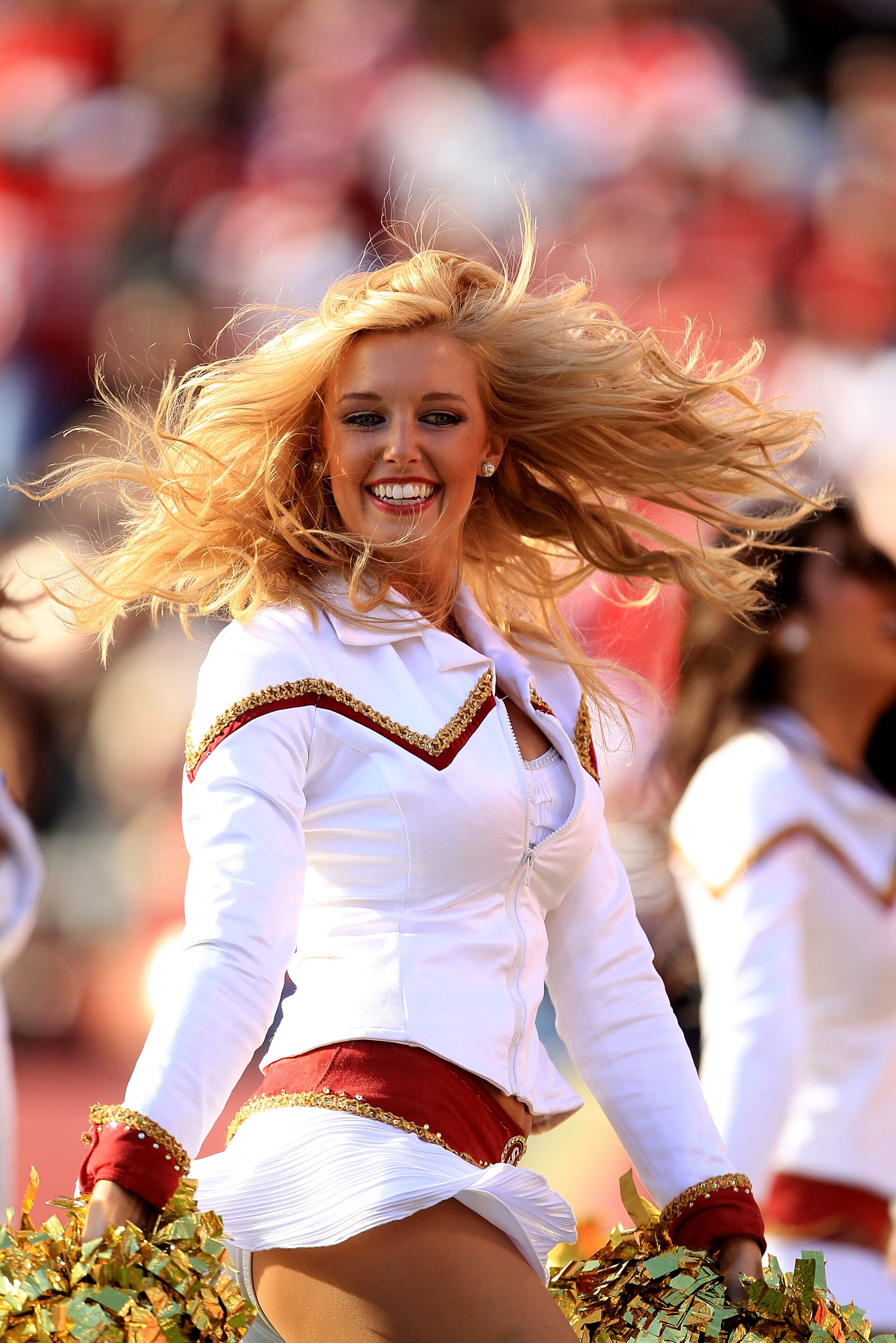 SAN FRANCISCO - NOVEMBER 21:  A memeber of the San Francisco 49ers Gold Rush cheerleaders performs during their game against the Tampa Bay Buccaneers at Candlestick Park on November 21, 2010 in San Francisco, California.  (Photo by Ezra Shaw/Getty Images)