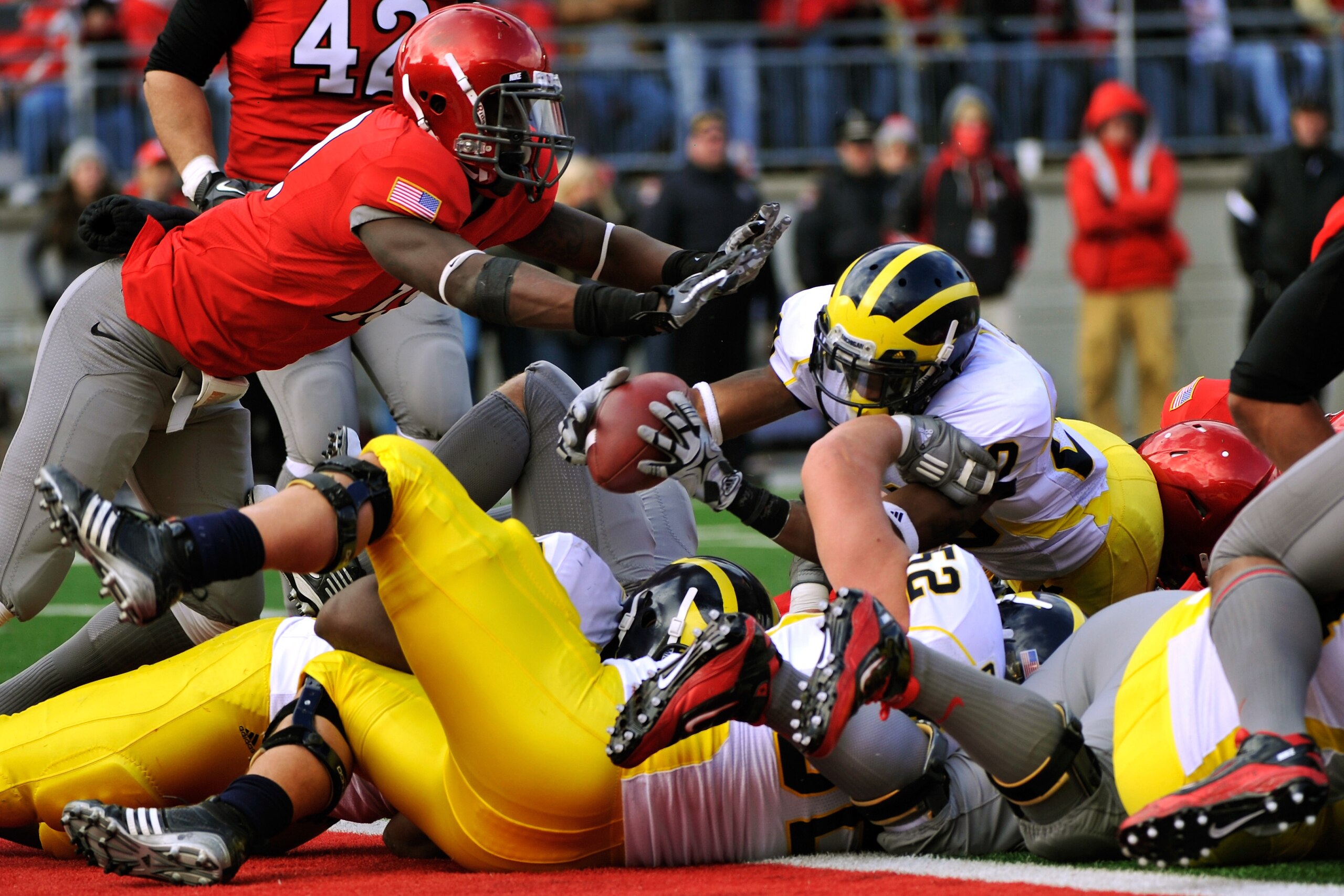 COLUMBUS, OH - NOVEMBER 27:  Michael Shaw #20 of the Michigan Wolverines lunges across the goal line for a touchdown in the second quarter against the Ohio State Buckeyes at Ohio Stadium on November 27, 2010 in Columbus, Ohio.  (Photo by Jamie Sabau/Getty