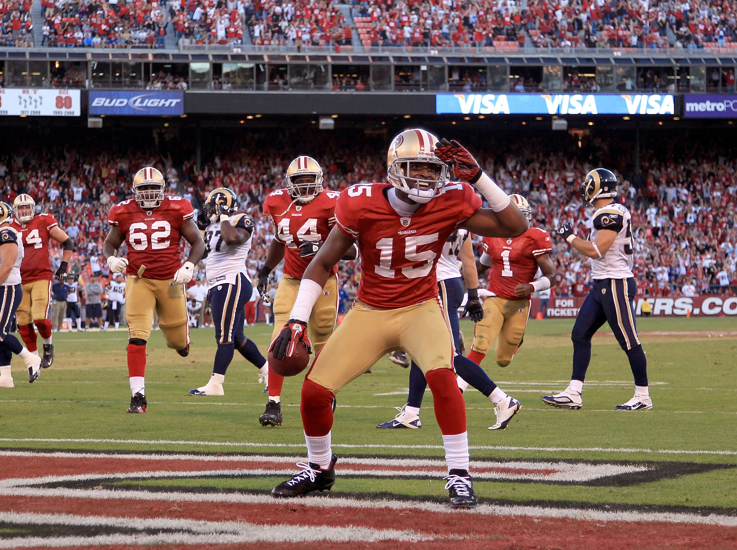 SAN FRANCISCO - NOVEMBER 14:  Michael Crabtree #15 of the San Francisco 49ers celebrates after scoring a touchdown against the St. Louis Rams at Candlestick Park on November 14, 2010 in San Francisco, California.  (Photo by Ezra Shaw/Getty Images)