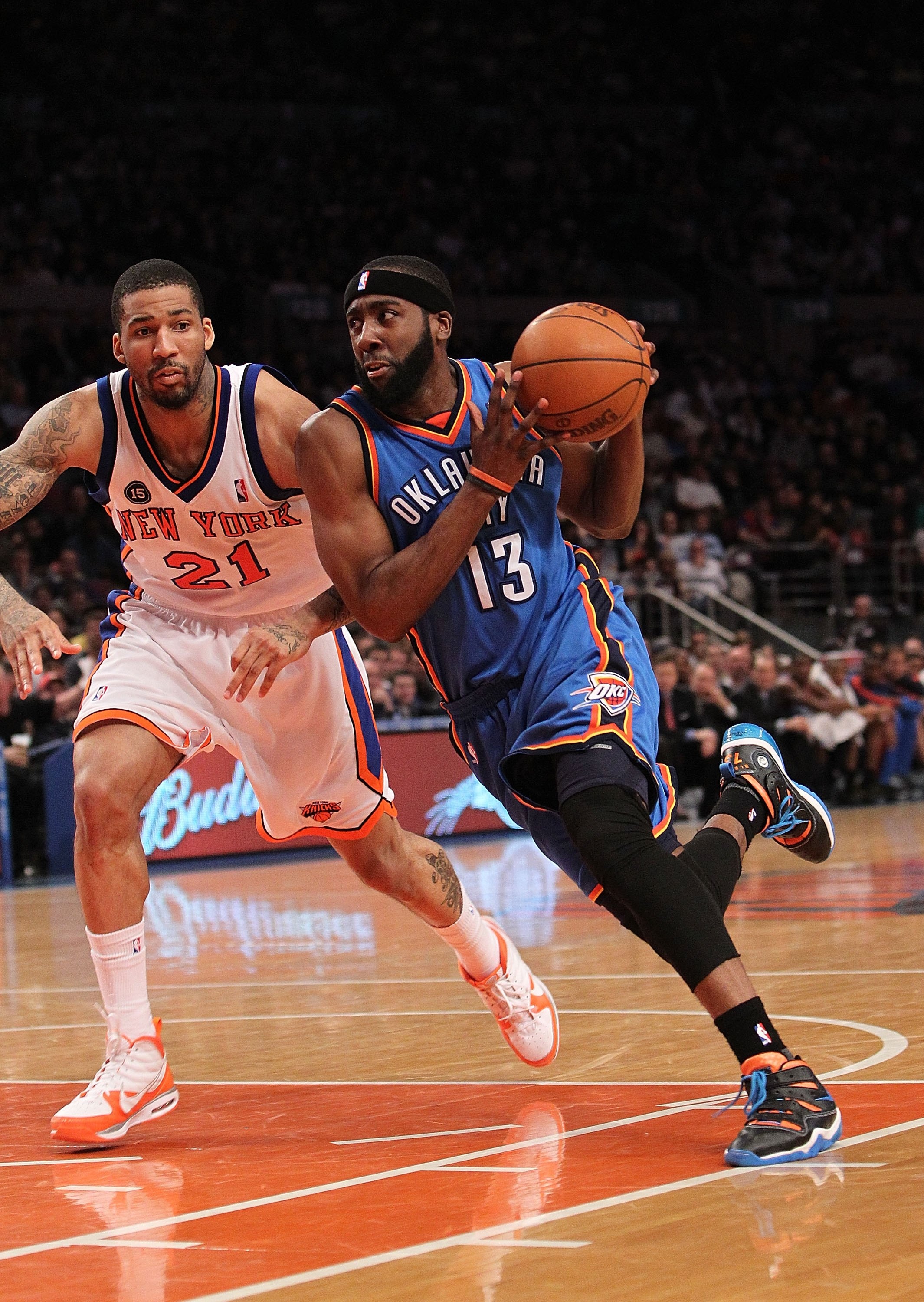 NEW YORK - FEBRUARY 20:  James Harden #13 of the Oklahoma City Thunder drives to the basket against Wilson Chandler #21 of the New York Knicks at Madison Square Garden on February 20, 2010 in New York, New York. NOTE TO USER: User expressly acknowledges a