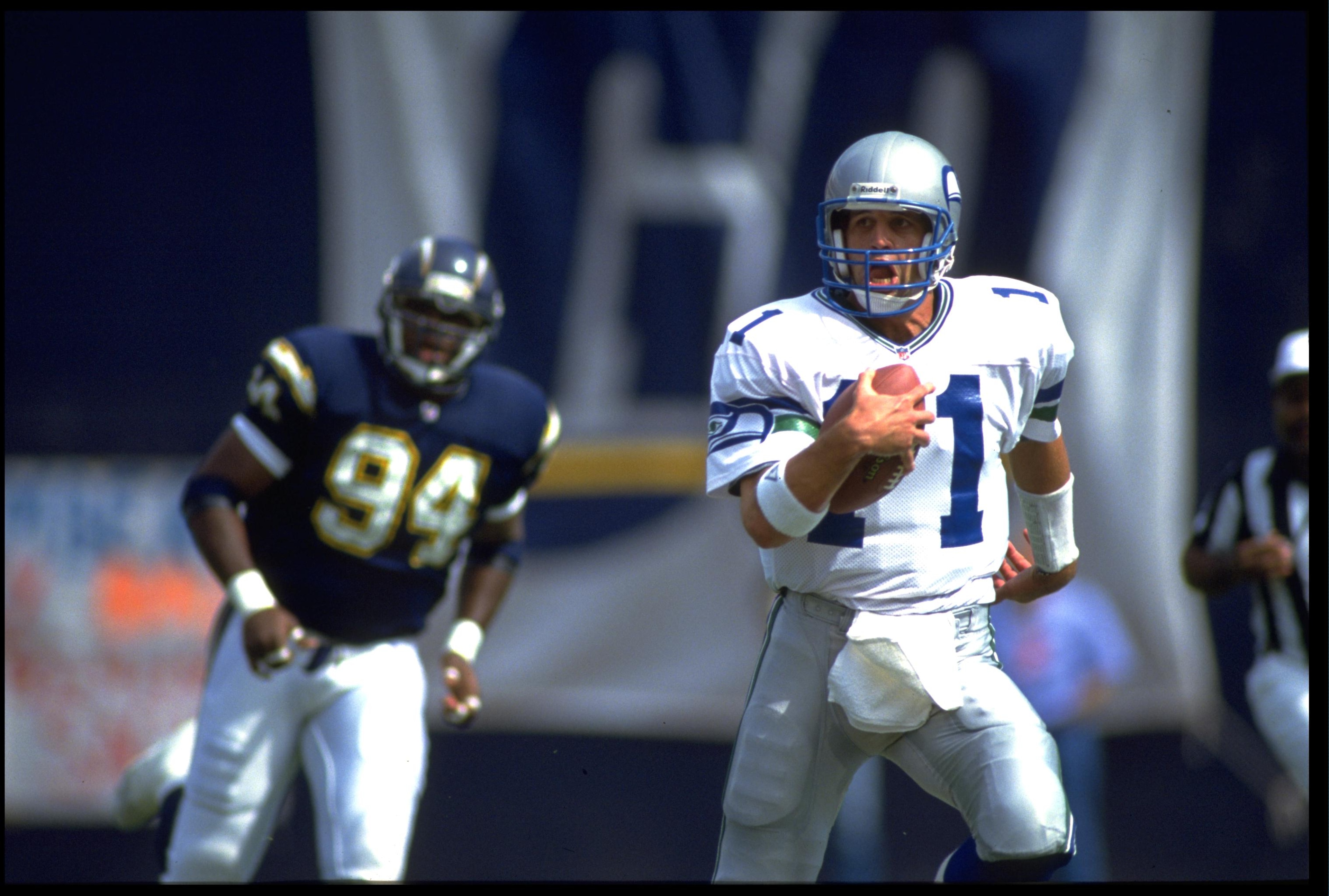 4 OCT 1992: SEATTLE SEAHAWKS QUARTERBACK KELLY STOUFFER #11 RUNS WITH THE FOOTBALL DURING THE SEAHAWKS 17-6 LOSS TO THE SAN DIEGO CHARGERS AT JACK MURPHY STADIUM IN SAN DIEGO, CALIFORNIA. MANDATORY CREDIT: CHRIS COVATTA/ALLSPORT 4 OCT 1992: SEATTLE SEAHAWKS QUARTERBACK KELLY STOUFFER #11 RUNS WITH THE FOOTBALL DURING THE SEAHAWKS 17-6 LOSS TO THE SAN DIEGO CHARGERS AT JACK MURPHY STADIUM IN SAN DIEGO, CALIFORNIA. MANDATORY CREDIT: CHRIS COVATTA/ALLSPORT