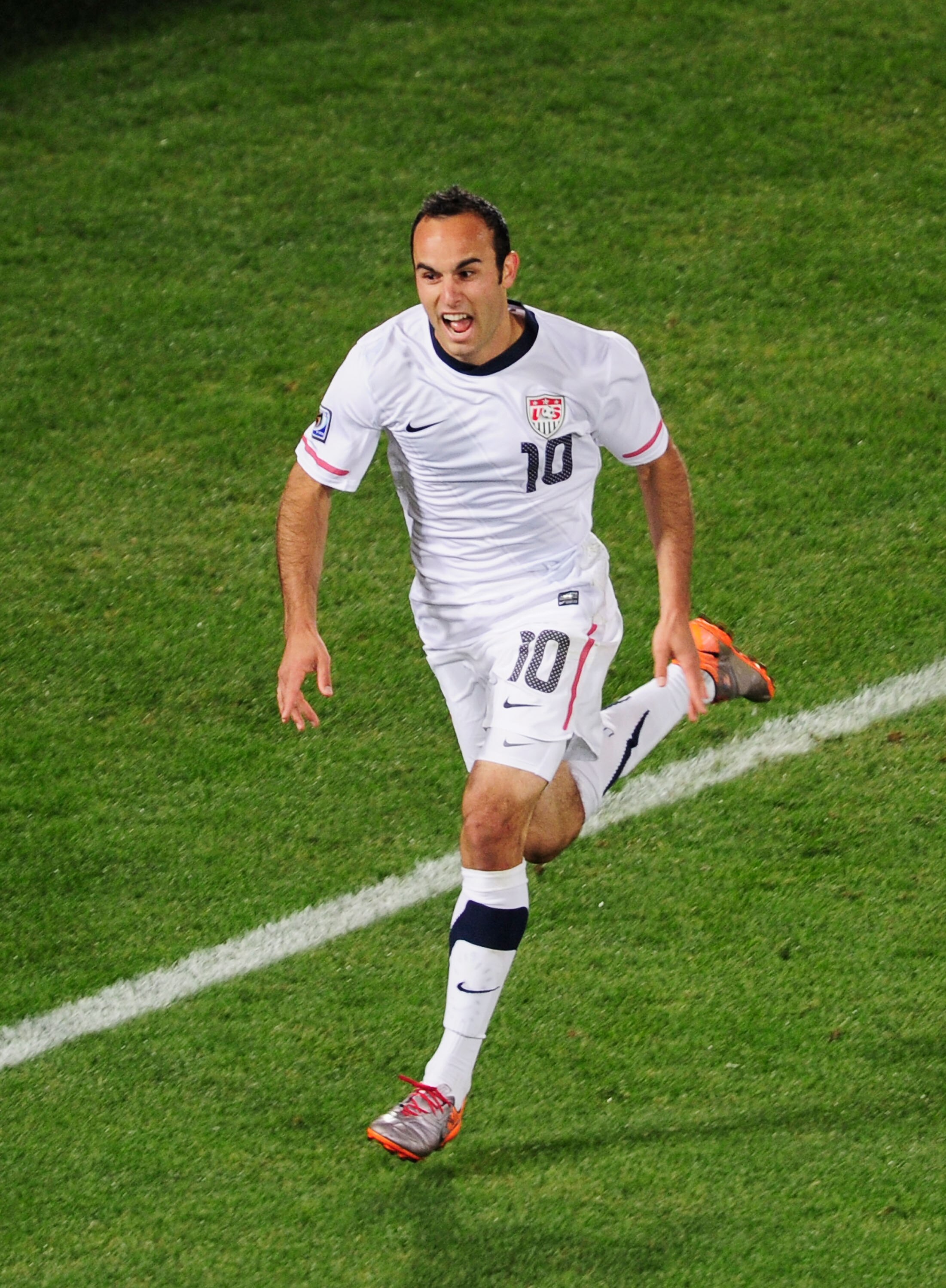 PRETORIA, SOUTH AFRICA - JUNE 23:  Landon Donovan of the United States celebrates scoring the winning goal that sends the USA through to the second round during the 2010 FIFA World Cup South Africa Group C match between USA and Algeria at the Loftus Versf