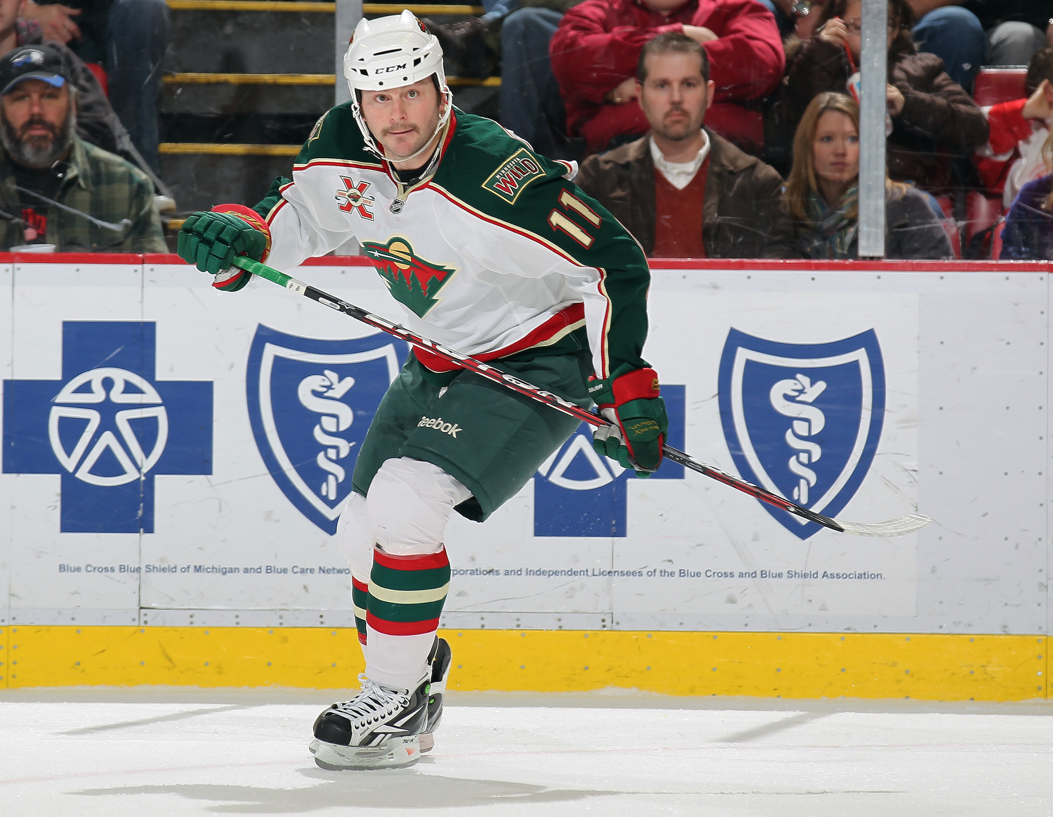 DETROIT, MI - NOVEMBER 19:  John Madden #11 of the Minnesota Wild skates in a game against the Detroit Red Wings on November 19, 2010 at the Joe Louis Arena in Detroit, Michigan. The Wild defeated the Wings 4-3 in overtime. (Photo by Claus Andersen/Getty