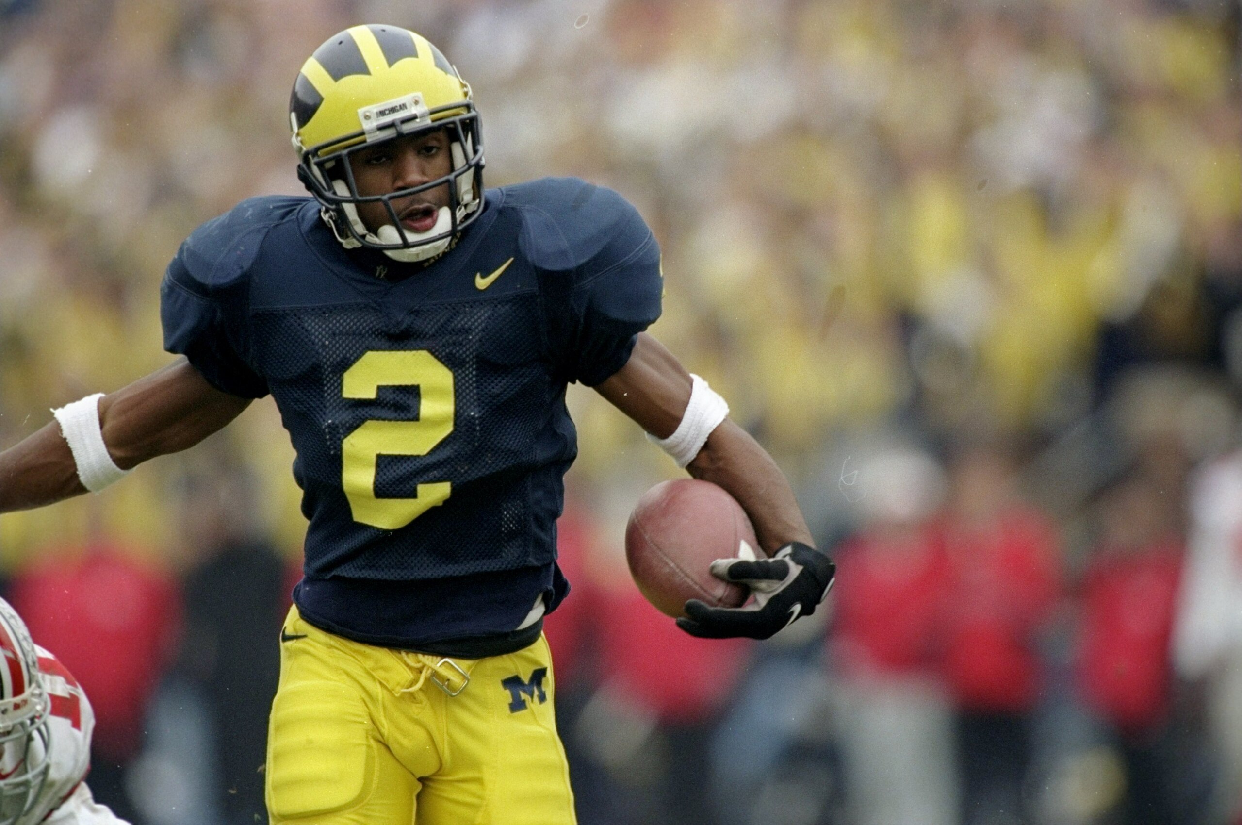 22 Nov 1997: Charles Woodson #2 of Michigan in action on during a game against Ohio State at Michigan Stadium in Ann Arbor, Michigan. Michigan defeated Ohio State 20-14. Mandatory Credit: Jonathan Daniel /Allsport 22 Nov 1997: Charles Woodson #2 of Michigan in action on during a game against Ohio State at Michigan Stadium in Ann Arbor, Michigan. Michigan defeated Ohio State 20-14. Mandatory Credit: Jonathan Daniel /Allsport