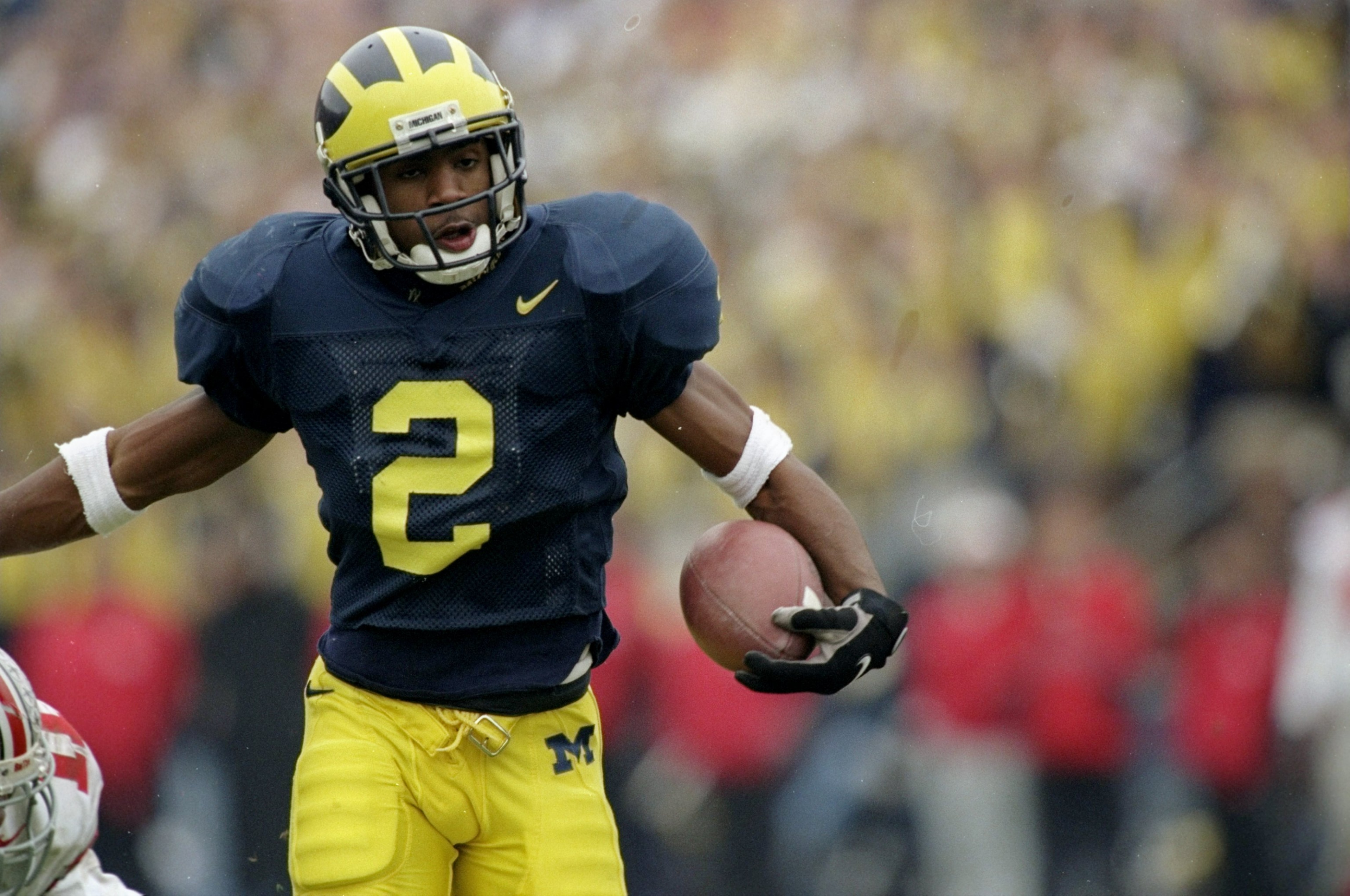22 Nov 1997: Charles Woodson #2 of Michigan in action on during a game against Ohio State at Michigan Stadium in Ann Arbor, Michigan. Michigan defeated Ohio State 20-14. Mandatory Credit: Jonathan Daniel /Allsport 22 Nov 1997: Charles Woodson #2 of Michigan in action on during a game against Ohio State at Michigan Stadium in Ann Arbor, Michigan. Michigan defeated Ohio State 20-14. Mandatory Credit: Jonathan Daniel /Allsport