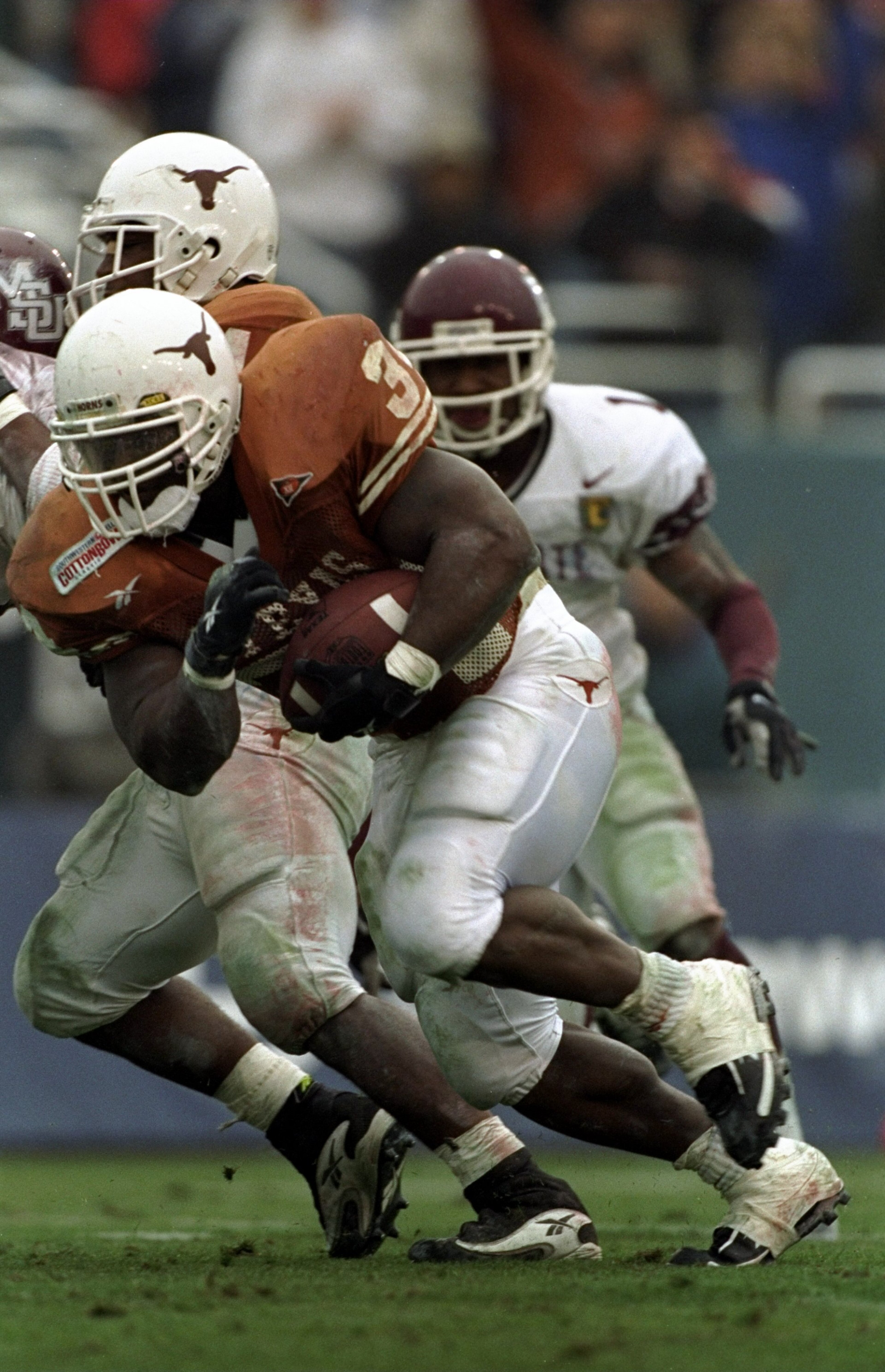 1 Jan 1999: Ricky Williams #34 of the Texas Longhorns carries the ball during the Southwest Bell Cotton Bowl against the Mississippi State Bulldogs at the Cotton Bowl in Dallas, Texas. Texas defeated Mississippi St 38-11. Mandatory Credit: Brian Bahr /Al 1 Jan 1999: Ricky Williams #34 of the Texas Longhorns carries the ball during the Southwest Bell Cotton Bowl against the Mississippi State Bulldogs at the Cotton Bowl in Dallas, Texas. Texas defeated Mississippi St 38-11. Mandatory Credit: Brian Bahr /Al