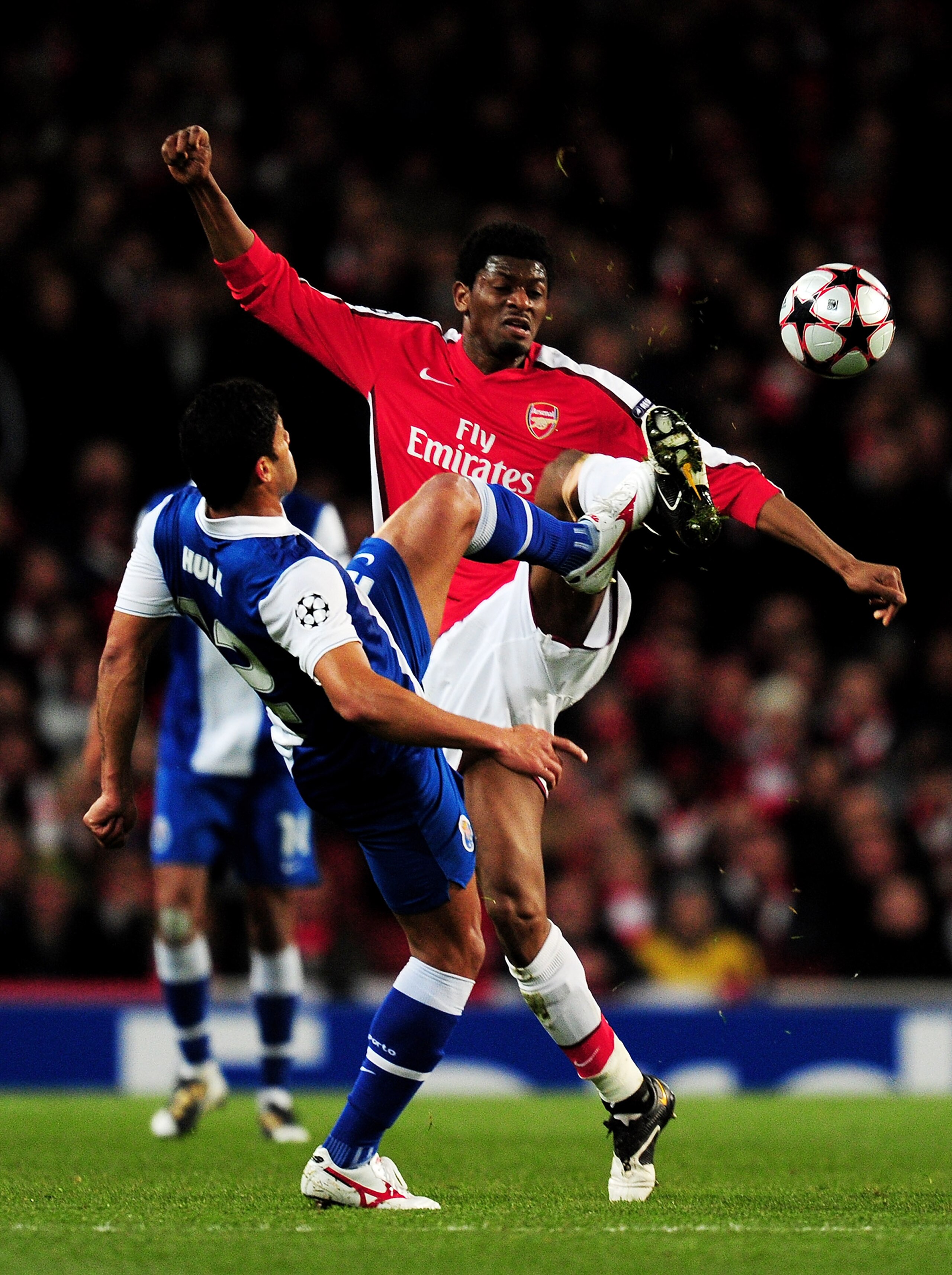 LONDON, ENGLAND - MARCH 09:  Abou Diaby of Arsenal battles for the ball with Hulk of Porto during the UEFA Champions League round of 16 match between Arsenal and FC Porto at the Emirates Stadium on March 9, 2010 in London, England.  (Photo by Mike Hewitt/
