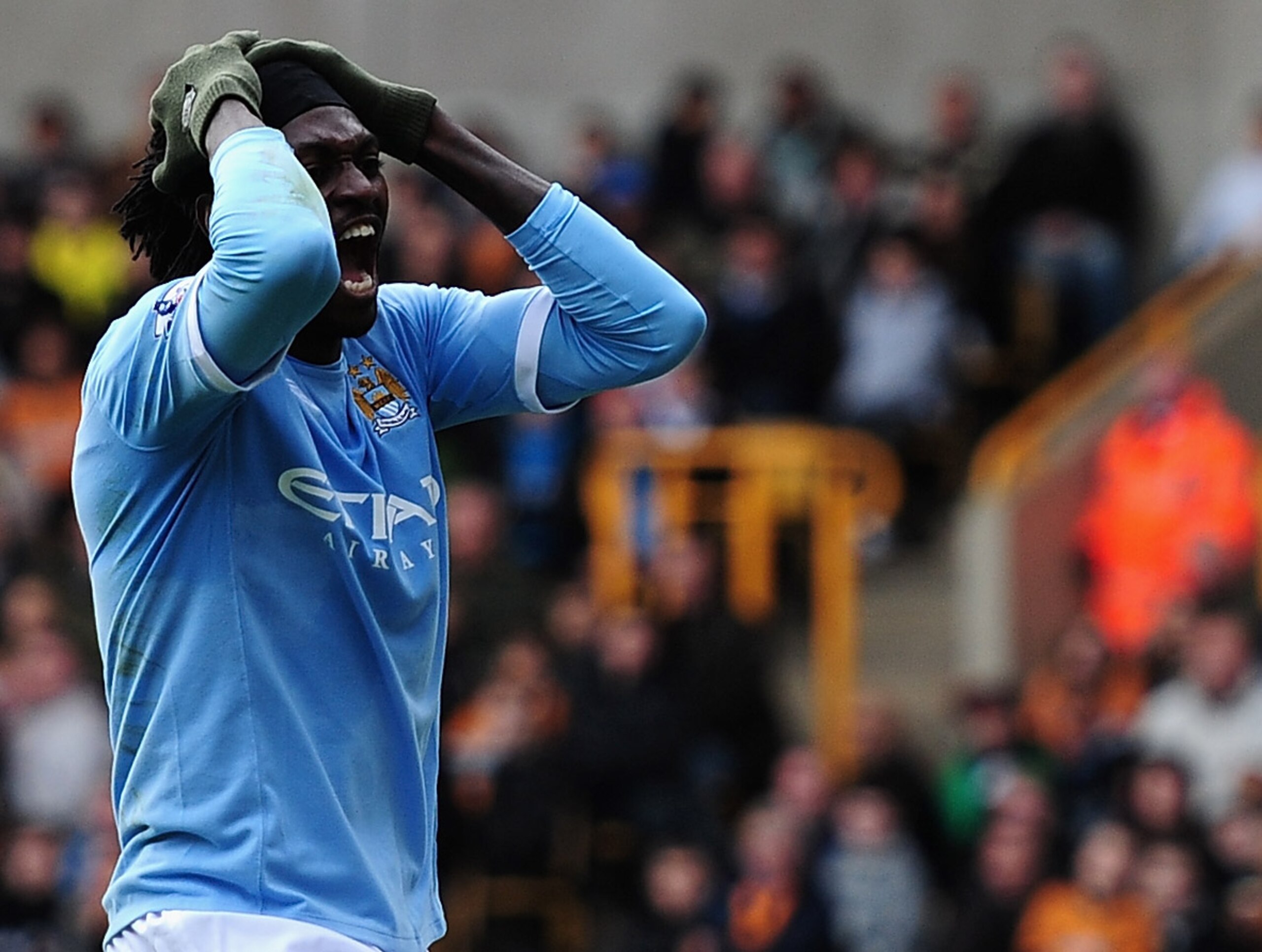 WOLVERHAMPTON, ENGLAND - OCTOBER 30:  Emmanuel Adebayor of Manchester City battles shows his frustrations after a wasted chance during the Barclays Premier League match between Wolverhampton Wanderers and Manchester City at Molineux on October 30, 2010 in