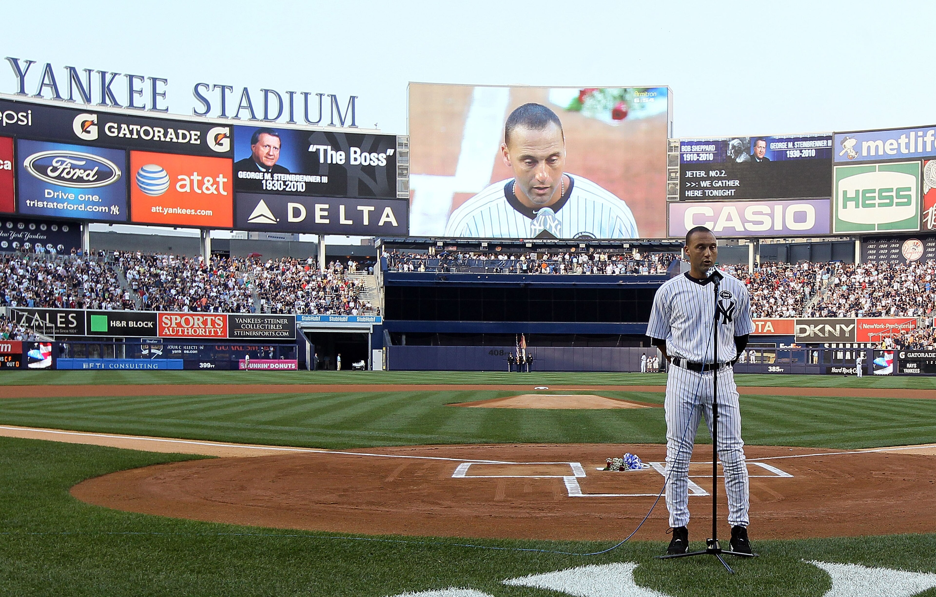 NEW YORK - JULY 16:  Captain Derek Jeter #2 of the New York Yankees speaks during the ceremony for owner George Steinbrenner and Yankee Stadium public address announcer Bob Sheppard before the game against theTampa Bay Rays on July 16, 2010 in the Bronx b