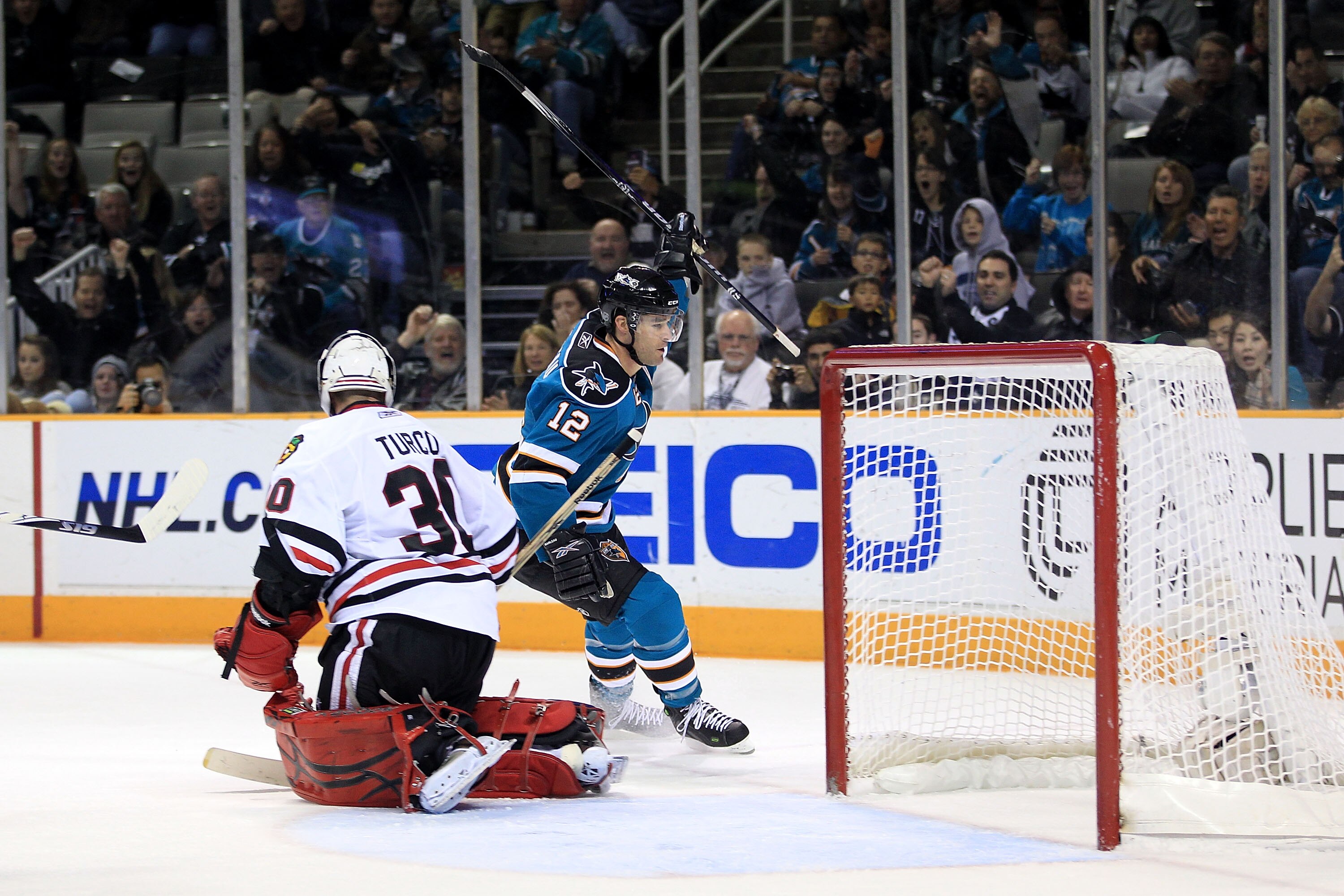 SAN JOSE, CA - NOVEMBER 24:  Patrick Marleau #12 of the San Jose Sharks celebrates after he scored a goal on Marty Turco #30 of the Chicago Blackhawks at HP Pavilion on November 24, 2010 in San Jose, California.  (Photo by Ezra Shaw/Getty Images)