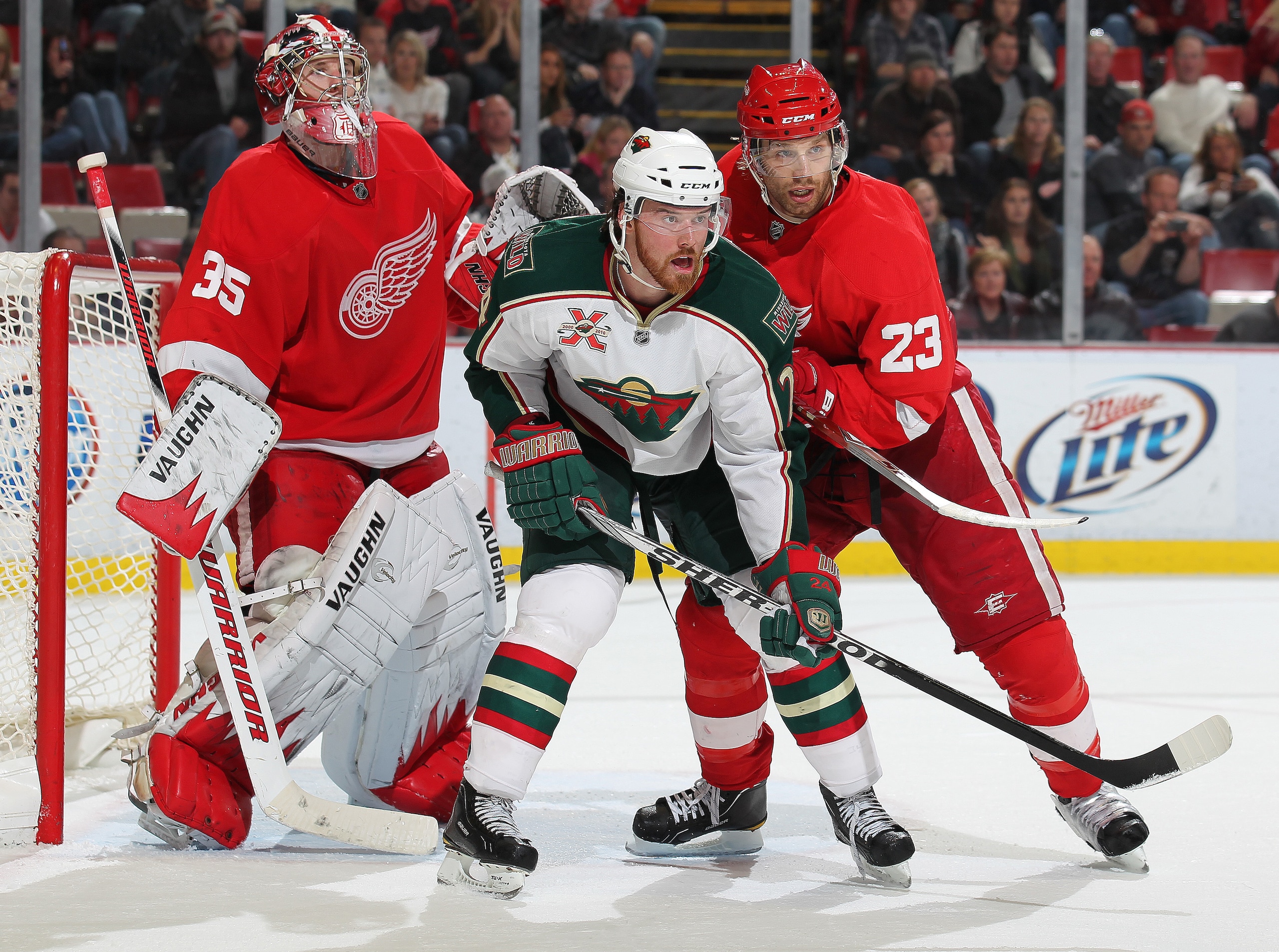 DETROIT,MI - NOVEMBER 19:  Martin Havlat #24 of the Minnesota Wild is held in check by Brad Stuart #23 of the Detroit Red Wings in a game on November 19, 2010 at the Joe Louis Arena in Detroit, Michigan. The Wild defeated the Wings 4-3 in overtime. (Photo