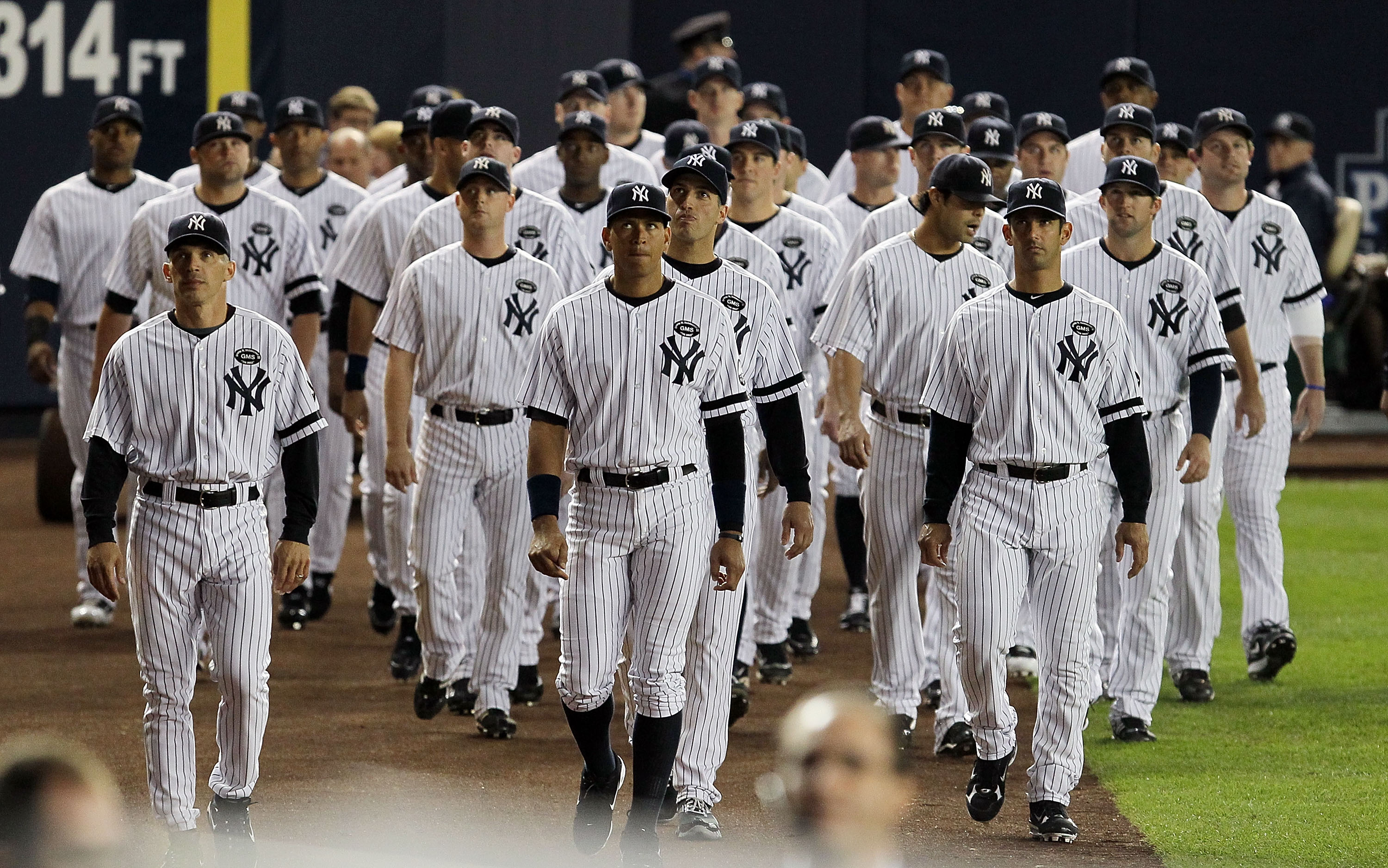 NEW YORK - SEPTEMBER 20:  Members of the New York Yankees attend the unveiling of late team owner George Steinbrenner's monument prior to playing against the Tampa Bay Rays on September 20, 2010 at Yankee Stadium in the Bronx borough of New York City.  (P