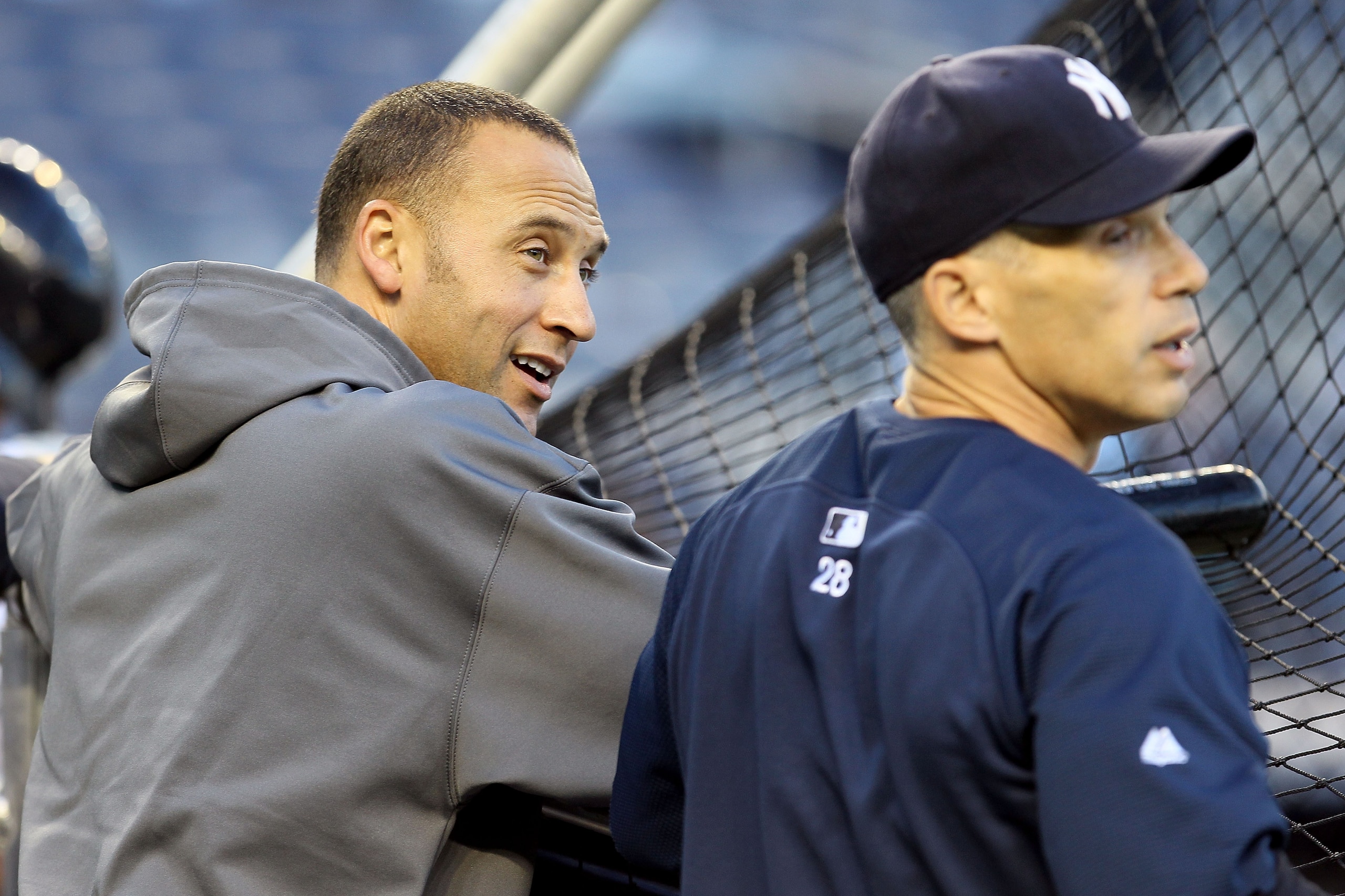 NEW YORK - OCTOBER 09:  (L-R) Derek Jeter #2 and manager Joe Girardi #28 of the New York Yankees look on during batting practice against the Minnesota Twins during Game Three of the ALDS part of the 2010 MLB Playoffs at Yankee Stadium on October 9, 2010 i