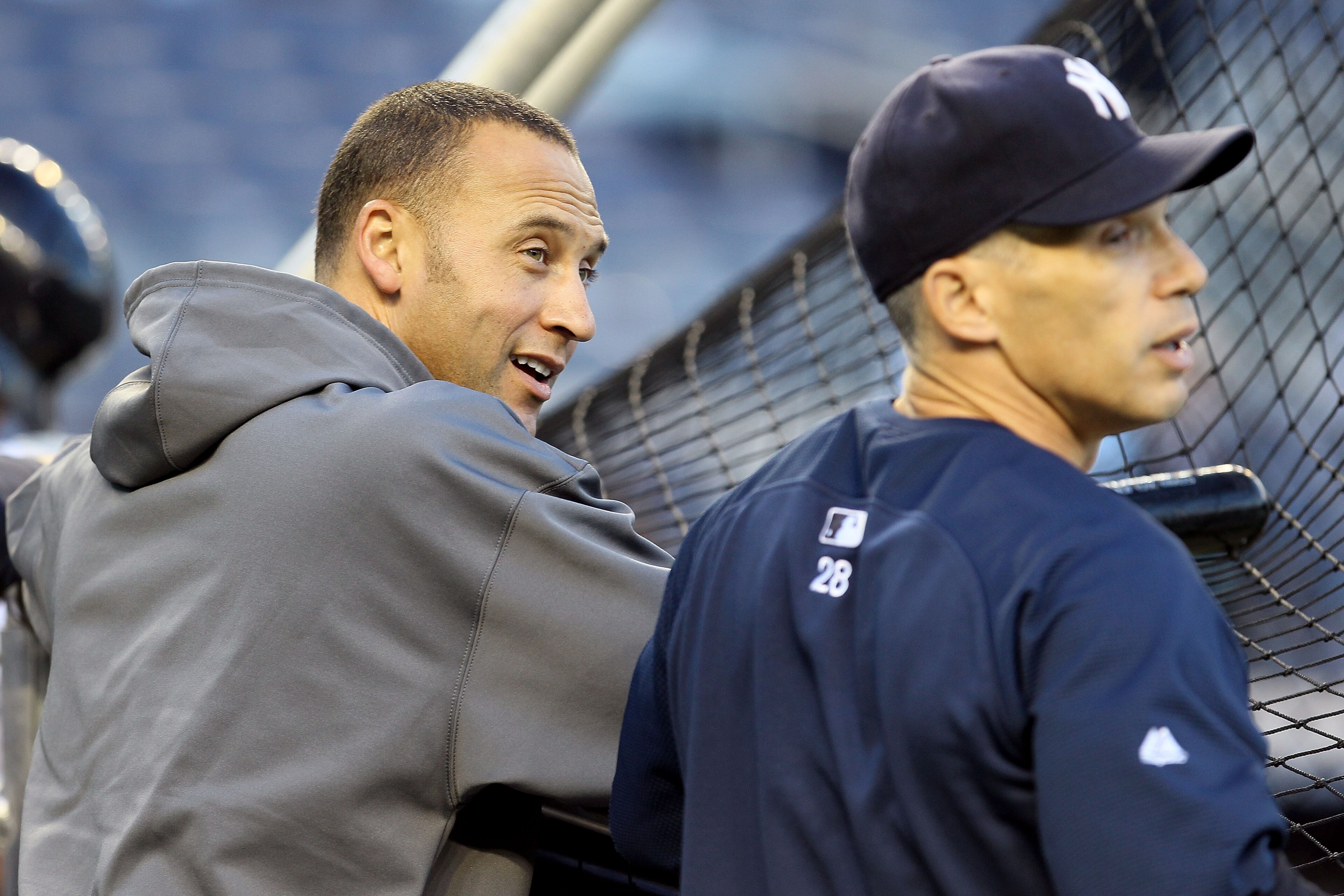 NEW YORK - OCTOBER 09:  (L-R) Derek Jeter #2 and manager Joe Girardi #28 of the New York Yankees look on during batting practice against the Minnesota Twins during Game Three of the ALDS part of the 2010 MLB Playoffs at Yankee Stadium on October 9, 2010 i