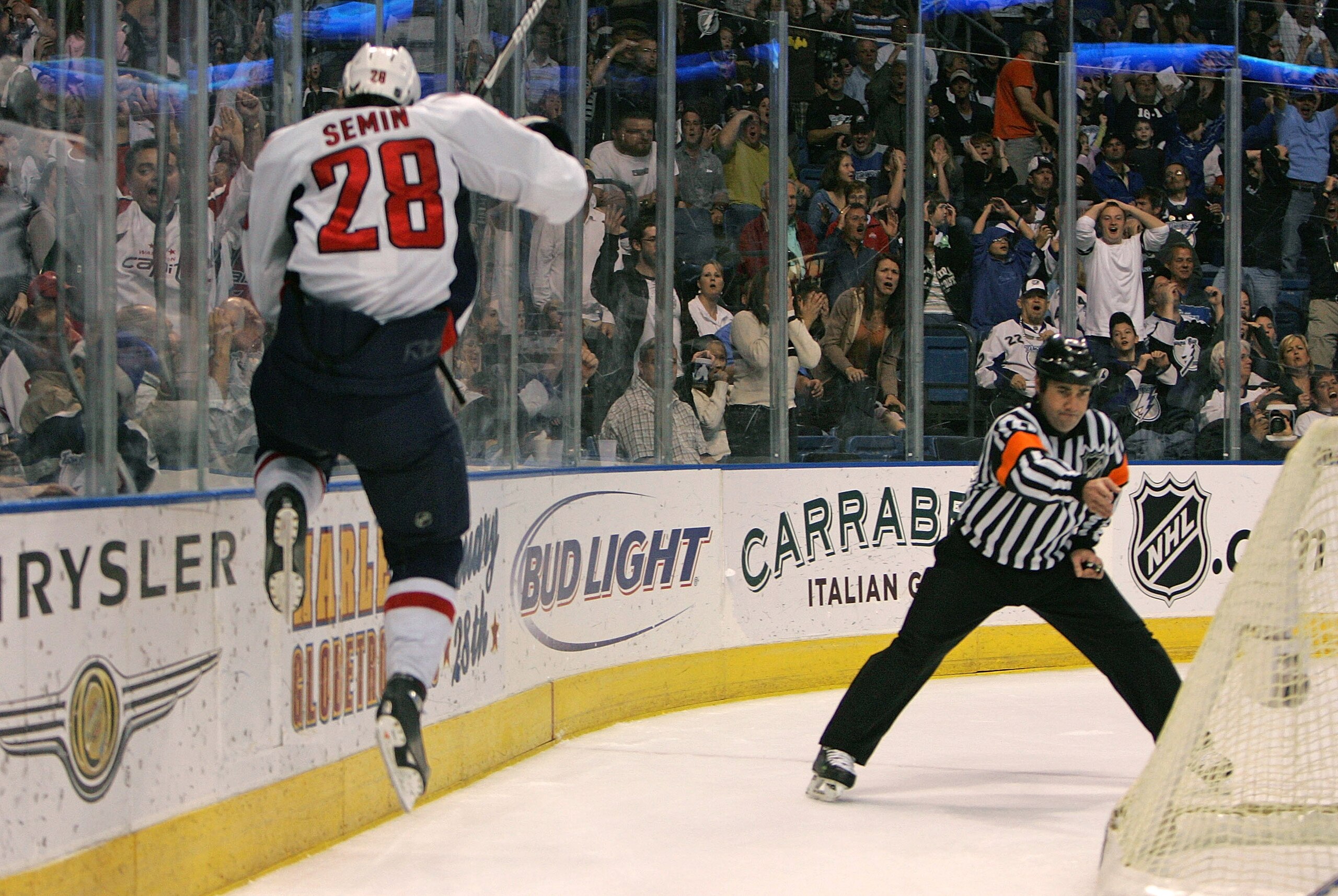 TAMPA, FL - FEBRUARY 16:  Referee Marc Joannette #25 signals a goal by Alexander Semin #28 of the Washington Capitals at 17:00 of the third period against the Tampa Bay Lightning. The goal turned out to be the winning goal in a 3-2 game at the St. Pete Ti