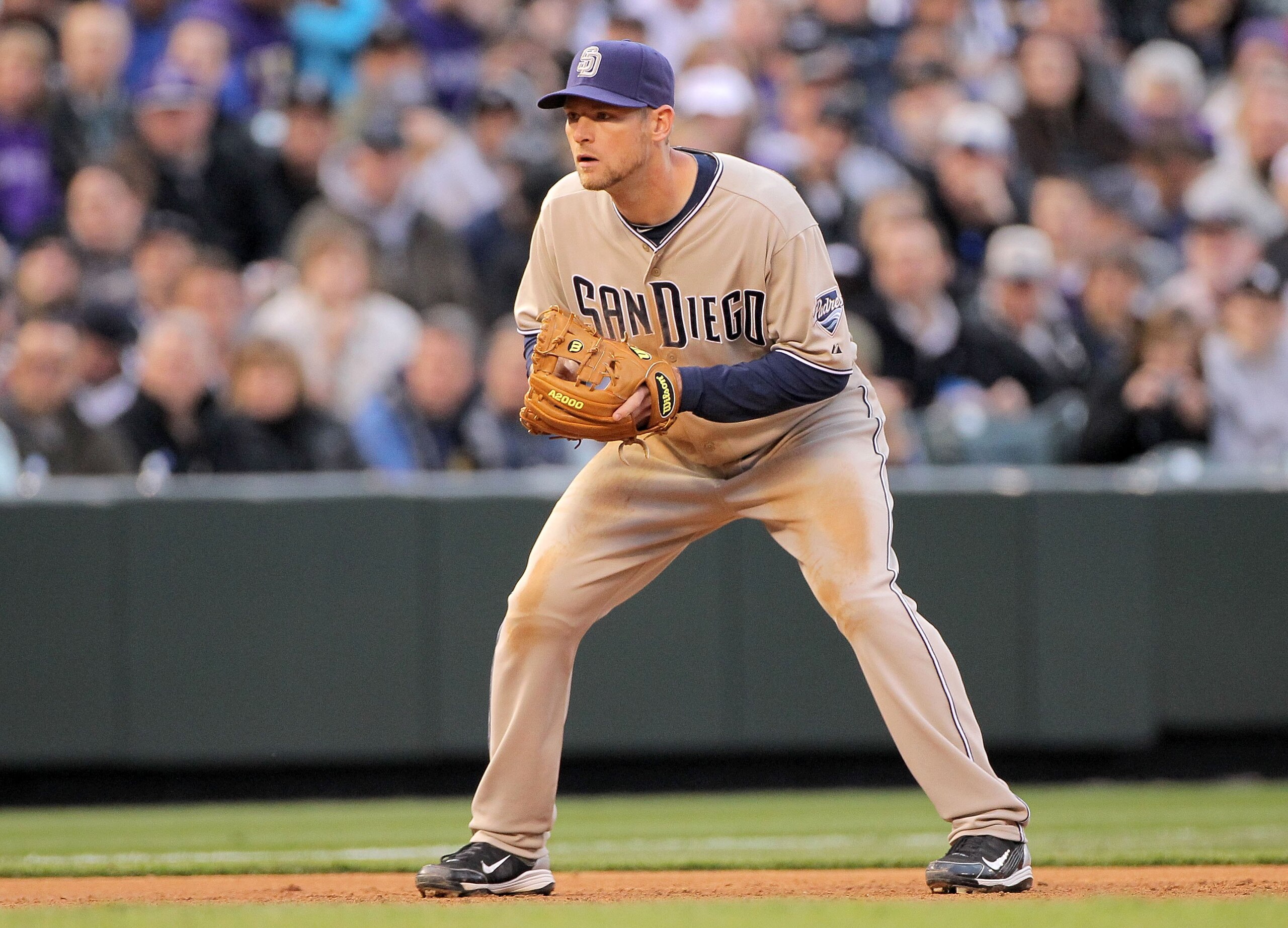 DENVER - APRIL 10:  Third baseman Chase Headley #7  of the San Diego Padres plays defense against the Colorado Rockies during MLB action at Coors Field on April 10, 2010 in Denver, Colorado. The Padres defeated the Rockies 5-4 in 14 innings.  (Photo by Do