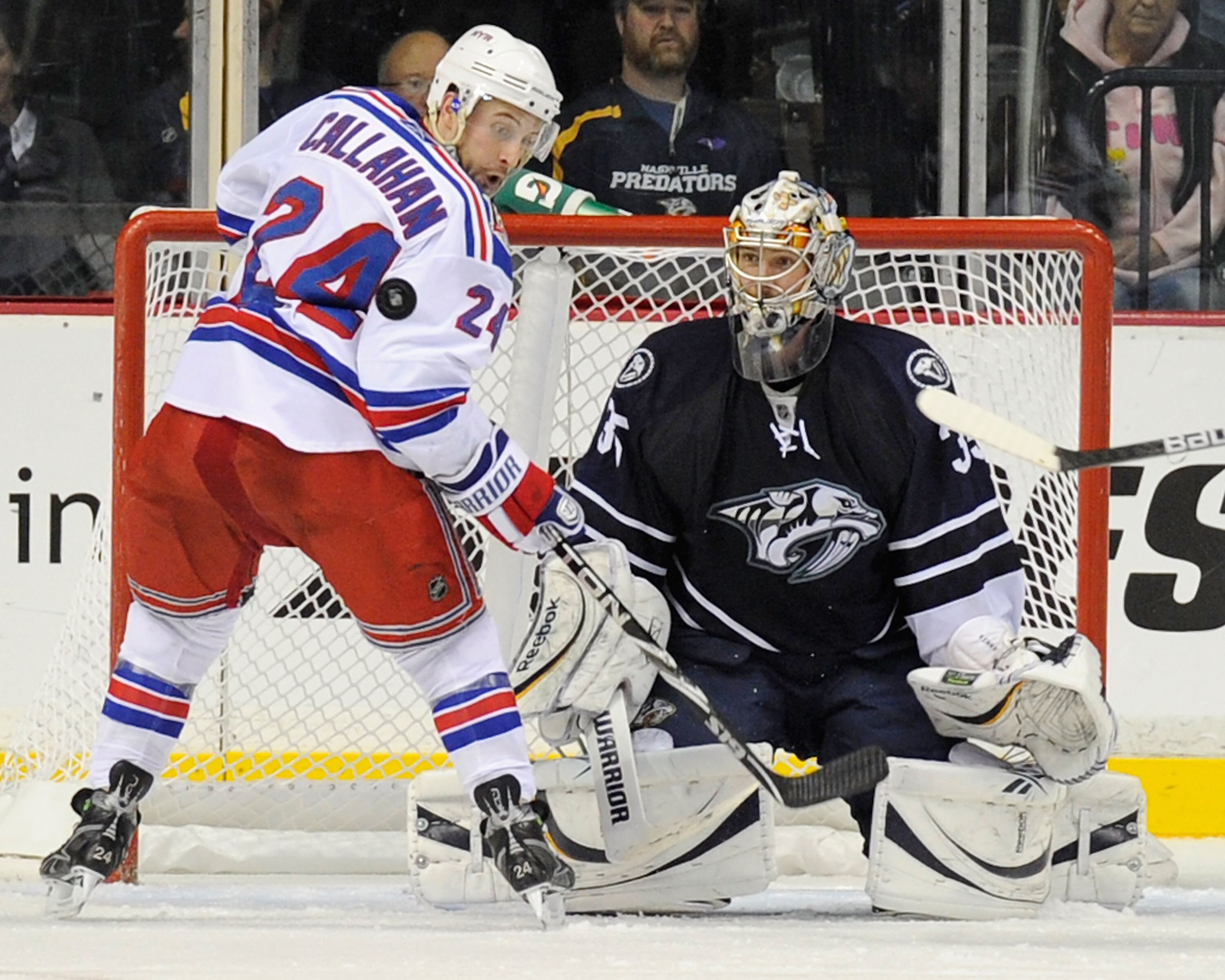 NASHVILLE, TN - NOVEMBER 27:  Pekka Rinne #35 of the Nashville Predators and Ryan Callahan #24 of the New York Rangers watch the puck on November 27, 2010 at the Bridgestone Arena in Nashville, Tennessee.  (Photo by Frederick Breedon/Getty Images)