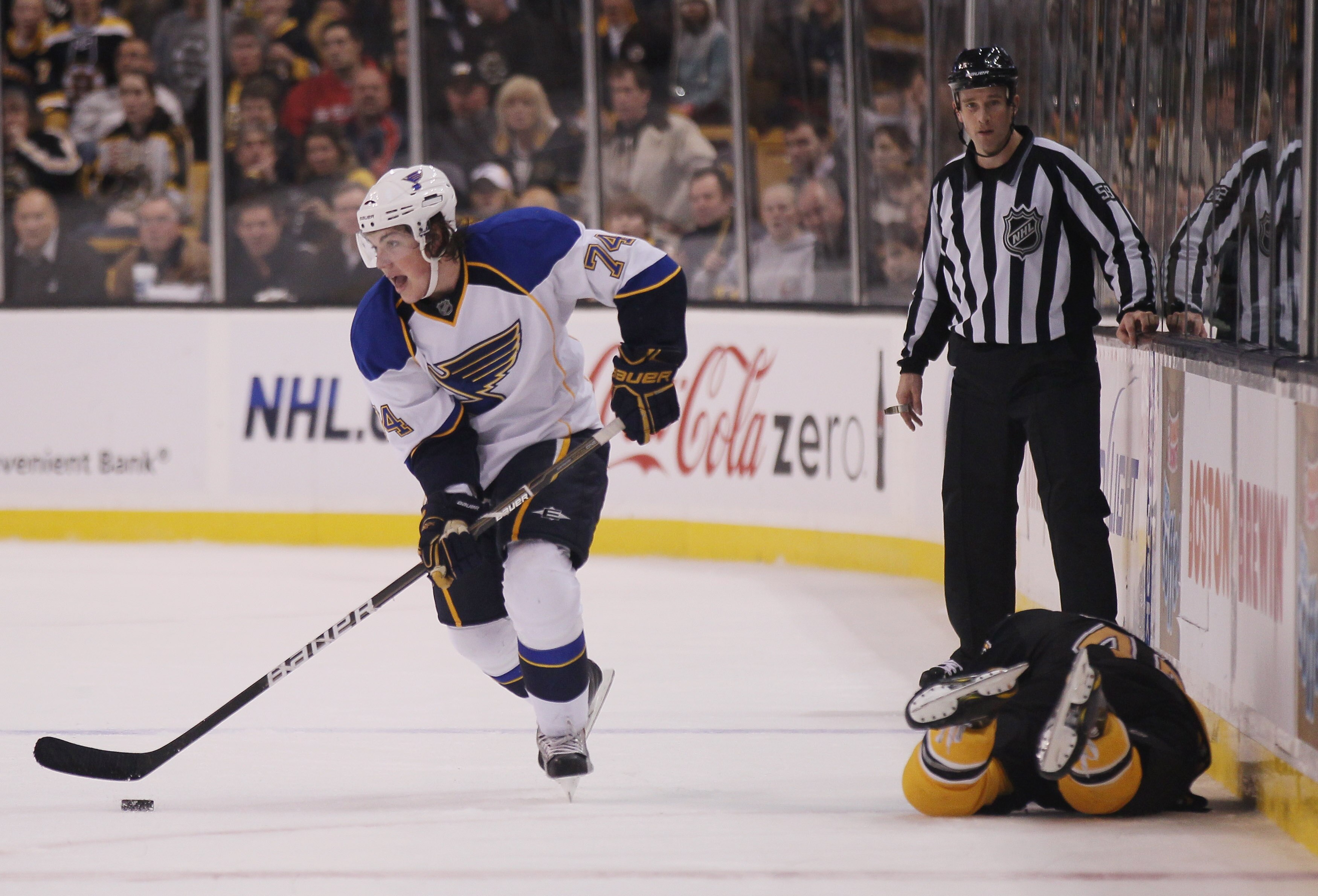 BOSTON - NOVEMBER 06:  TJ Oshie #74 of the St. Louis Blues takes the puck after he hit David Krejci #46 of the Boston Bruins on November 6, 2010 at the TD Garden in Boston, Massachusetts. The Blues defeated the Bruins 2-1 in an overtime shootout.  (Photo