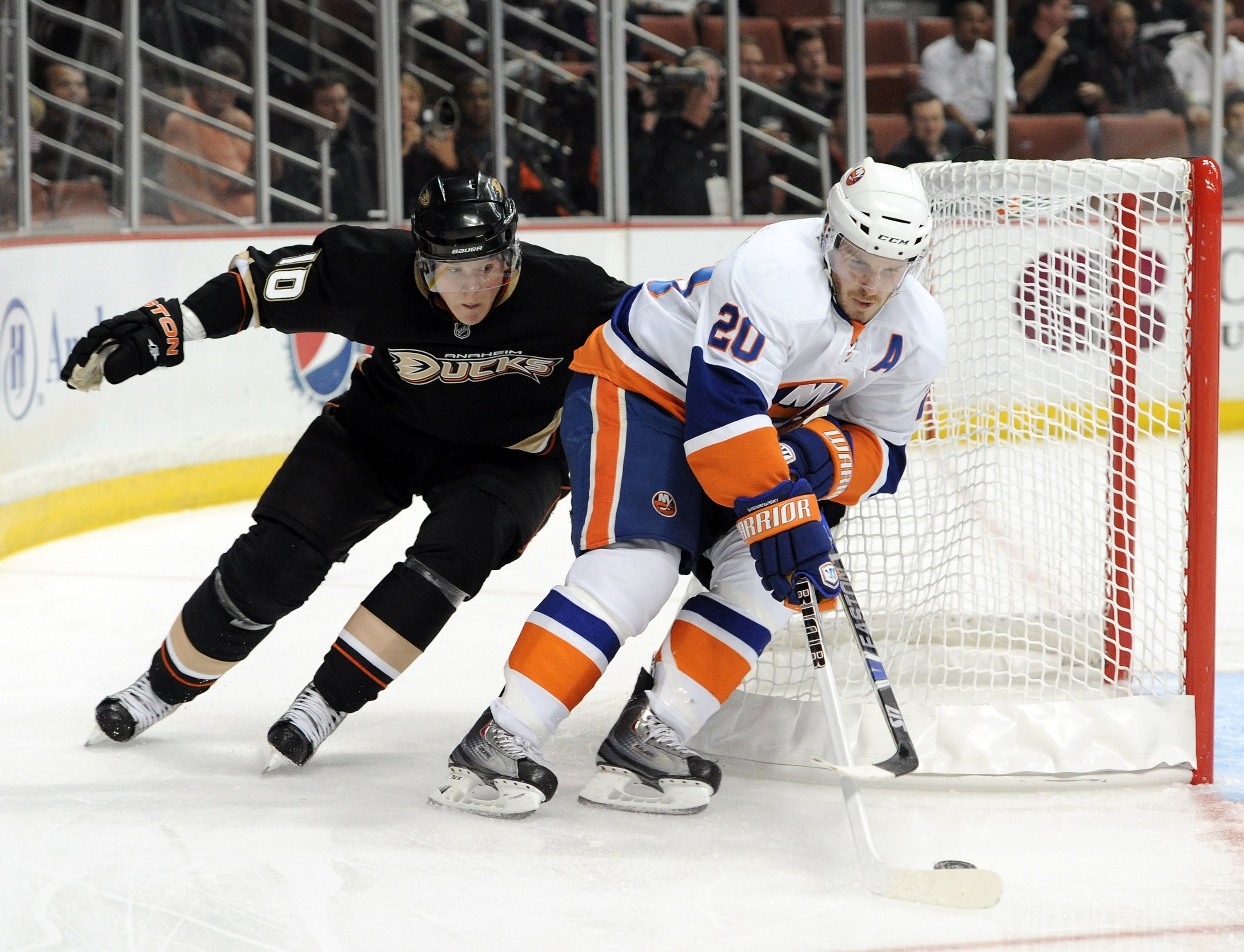 ANAHEIM, CA - NOVEMBER 10:  James Wisniewski #20 of the New York Islandersis chased by Corey Perrry #10 of  the Anaheim Ducks at the Honda Center on November 10, 2010 in Anaheim, California.  (Photo by Harry How/Getty Images)