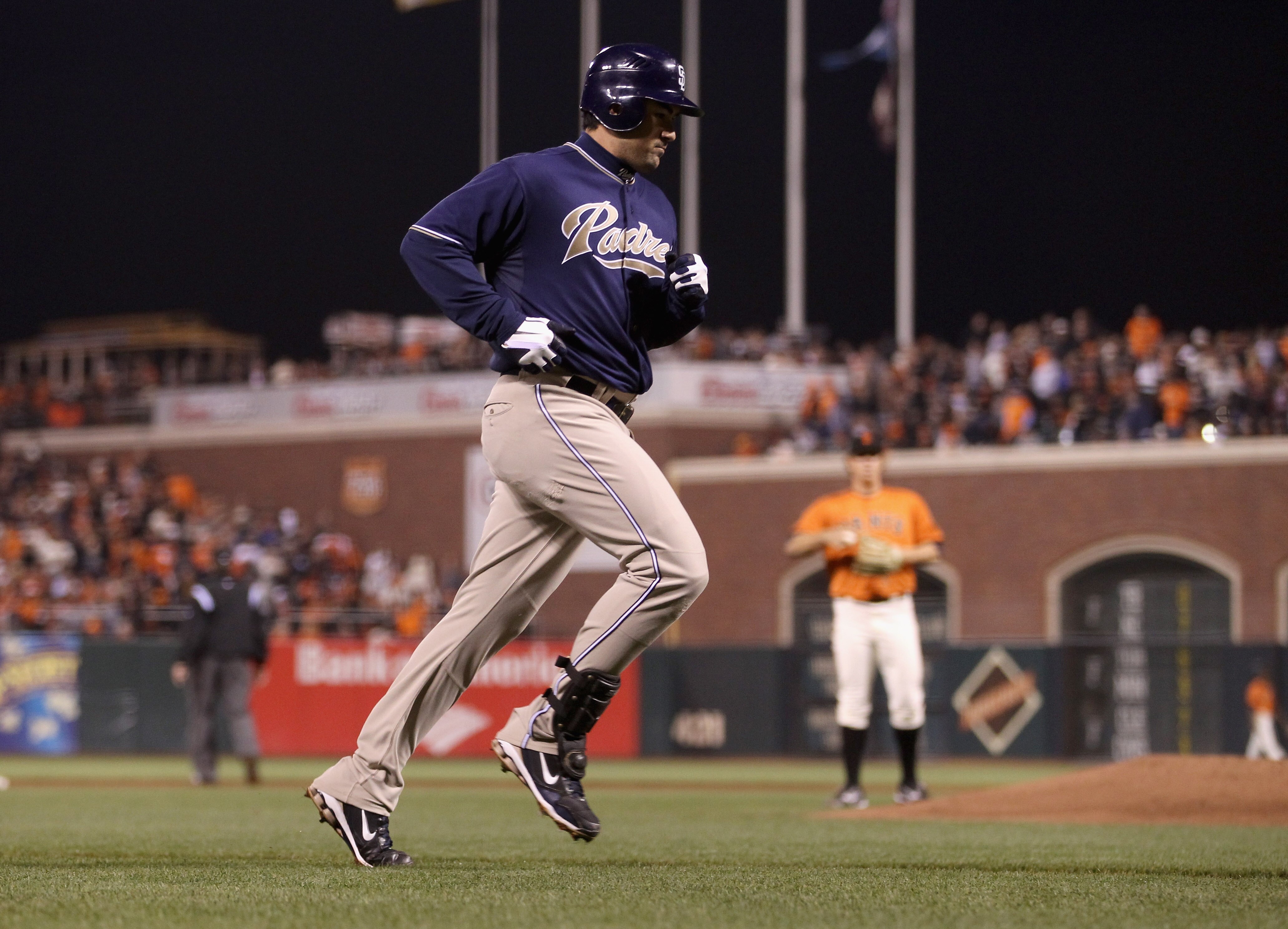 SAN FRANCISCO - OCTOBER 01:  Adrain Gonzalez #23 of the San Diego Padres rounds the bases after he hit a three-run home run to give the Padres a 4-0 lead over Matt Cain #18 and the San Francisco Giants in the third inning at AT&T Park on October 1, 2010 i